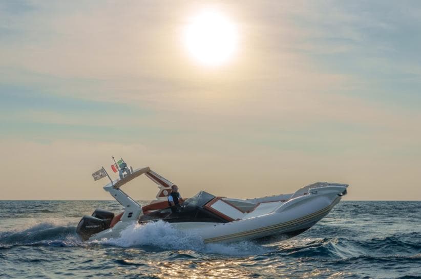Solemar SX 30 boat cruising on the ocean at sunset, 2025 model.