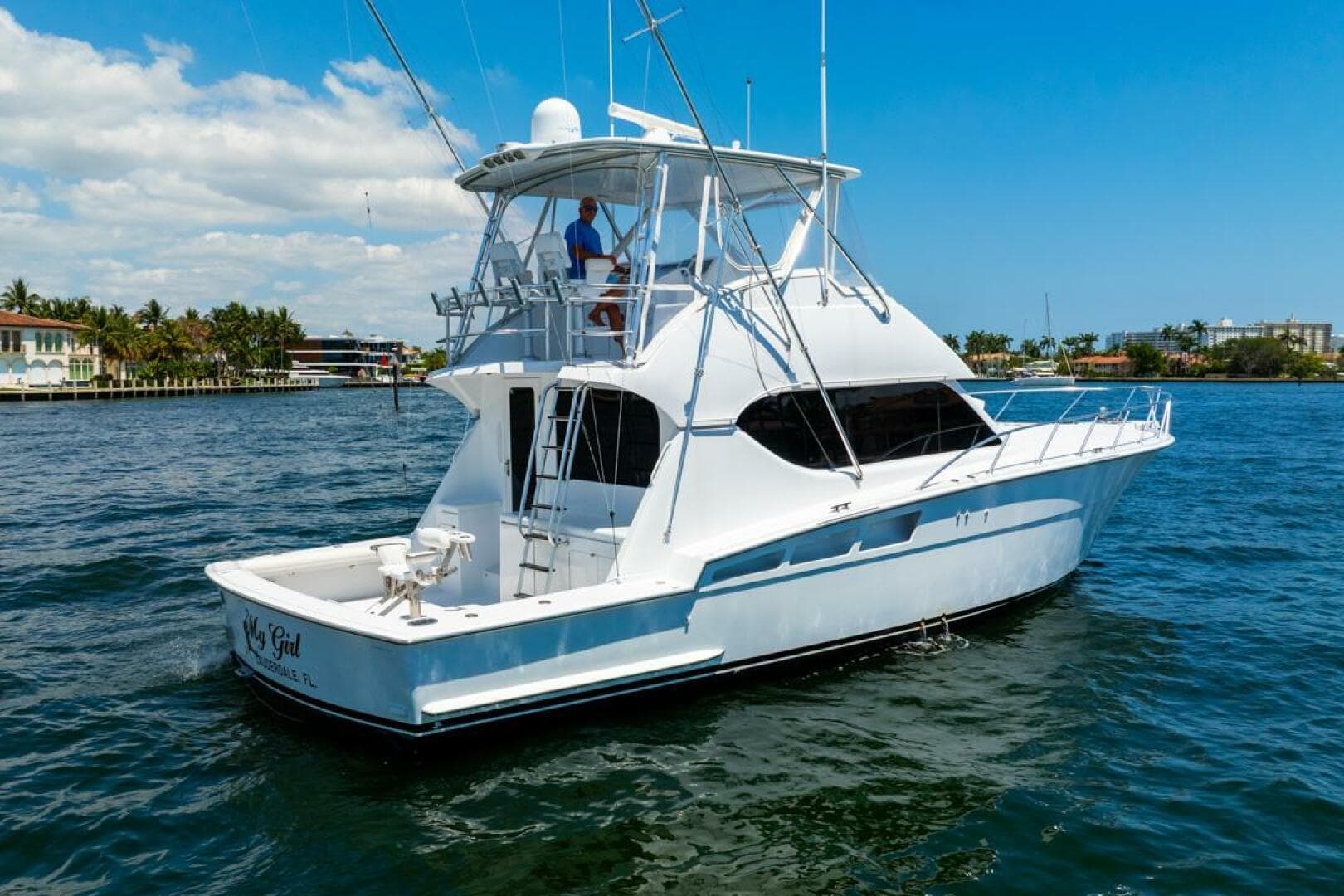 2005 Hatteras 50 Convertible Sportfish yacht cruising on a sunny day.