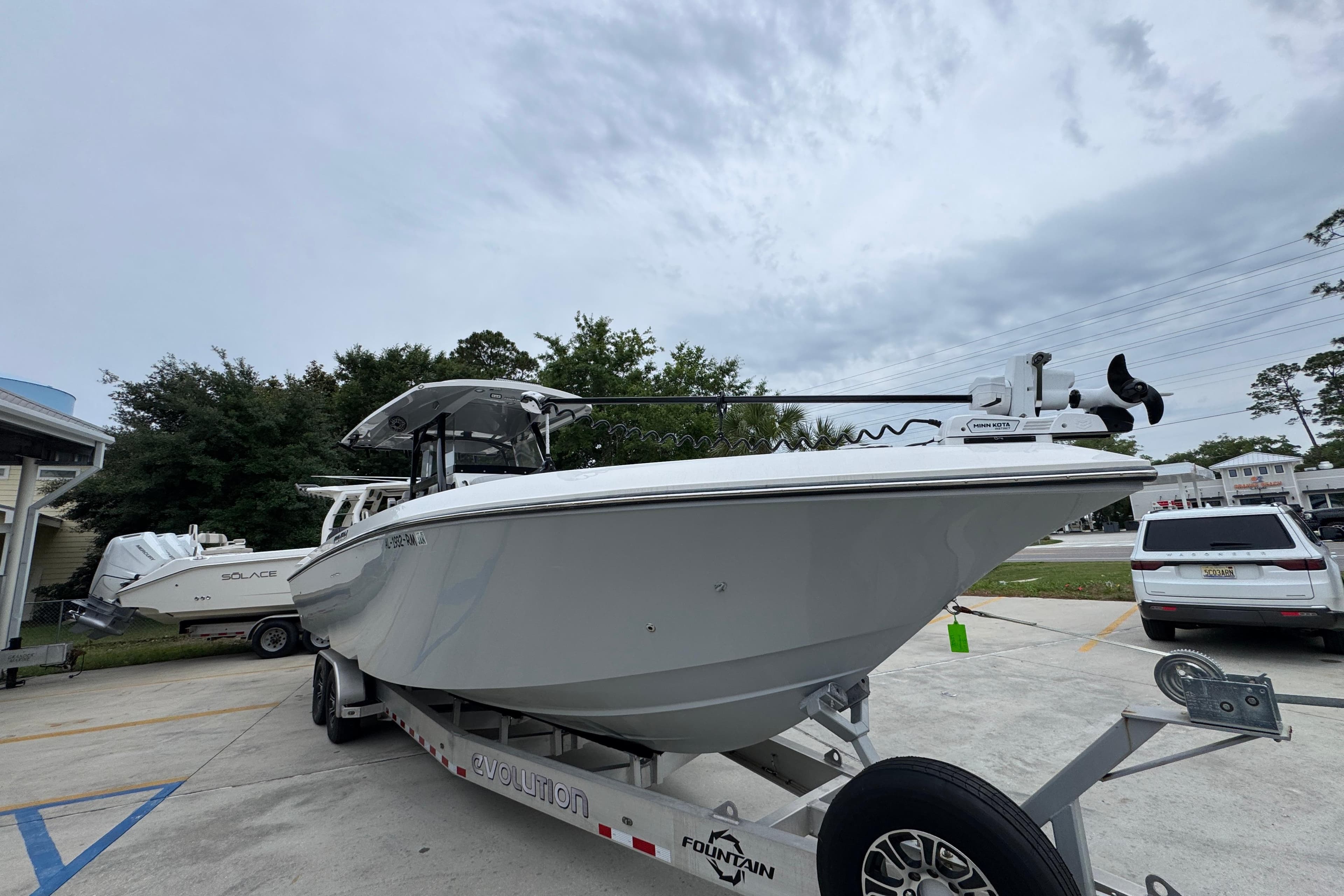 2021 Fountain 34 Center Console boat on trailer, parked outdoors.