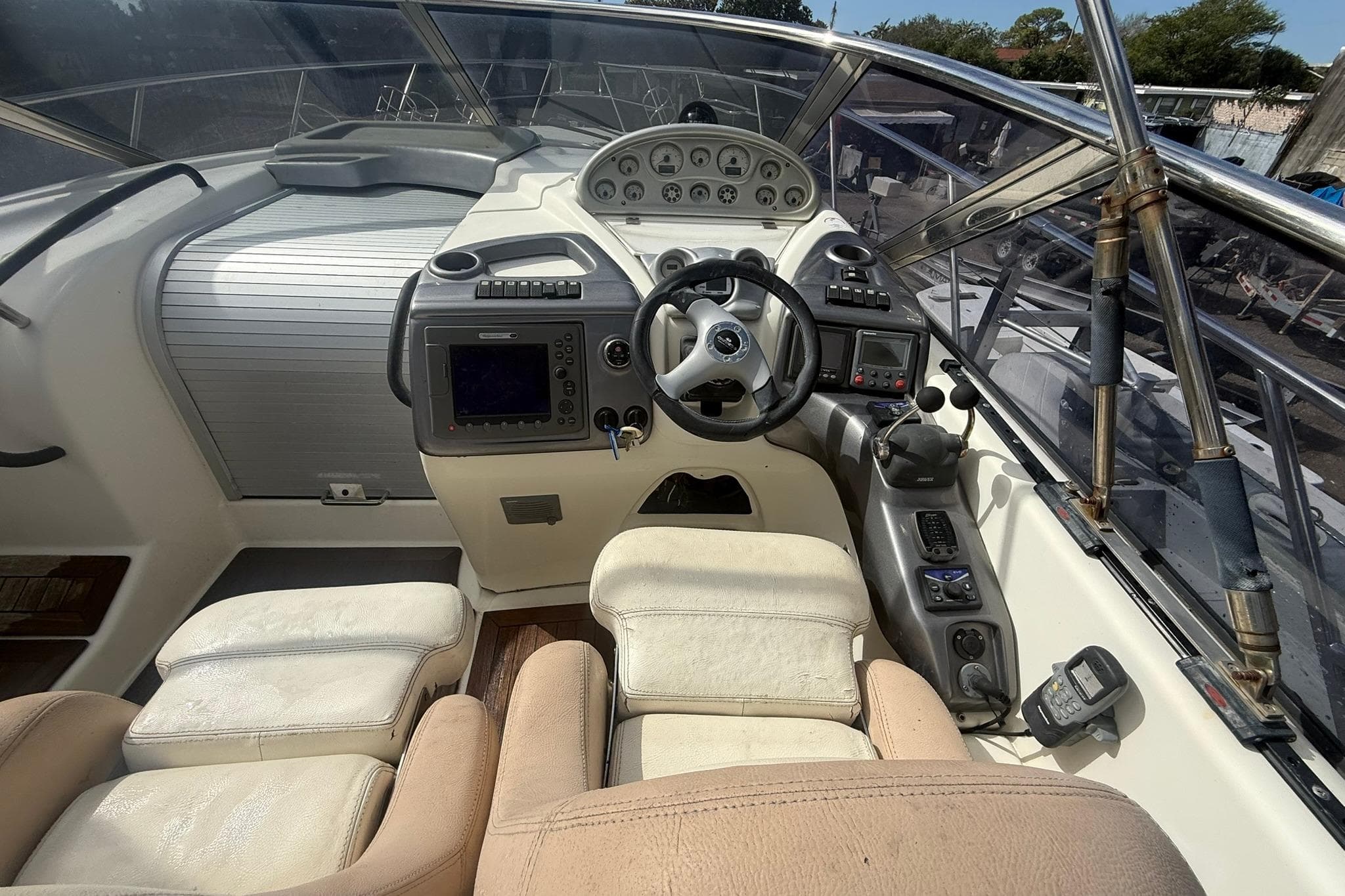 Cockpit of 2009 Cranchi Endurance 41 yacht with steering wheel and navigation controls.