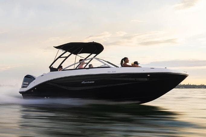 Manufacturer Provided Image: 2023 Hurricane SunDeck 235 OB boat cruising on water at sunset.