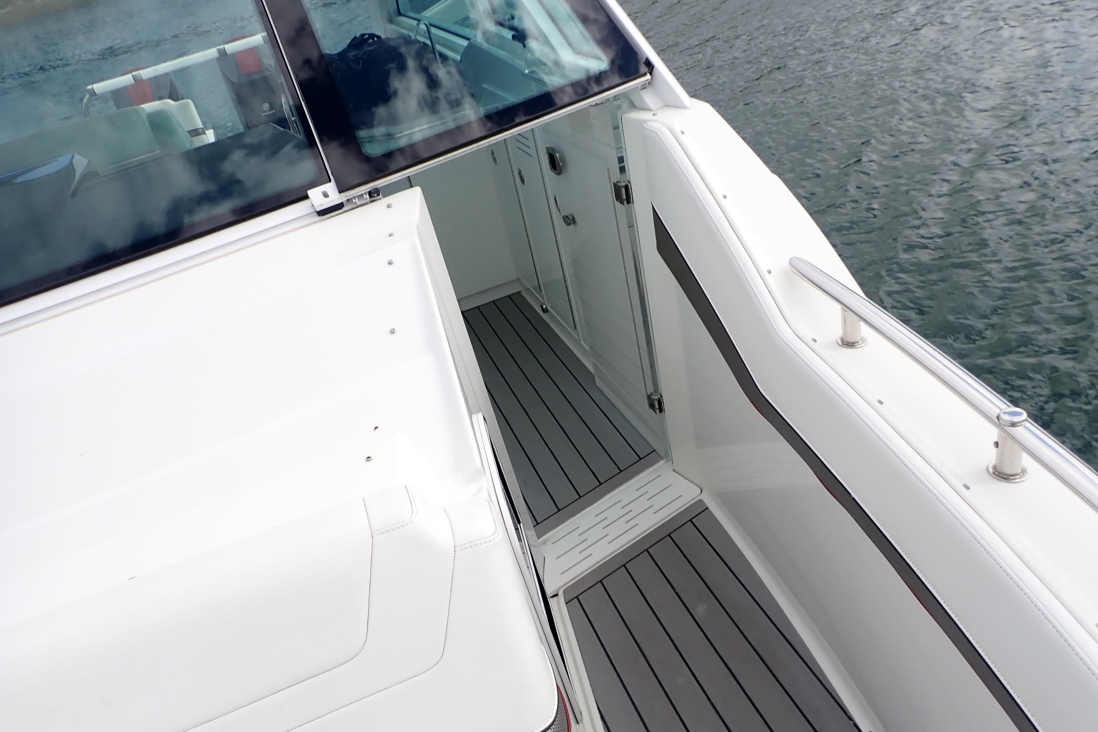 2022 Formula 380 Super Sport Crossover OB boat deck with sleek design and water view.