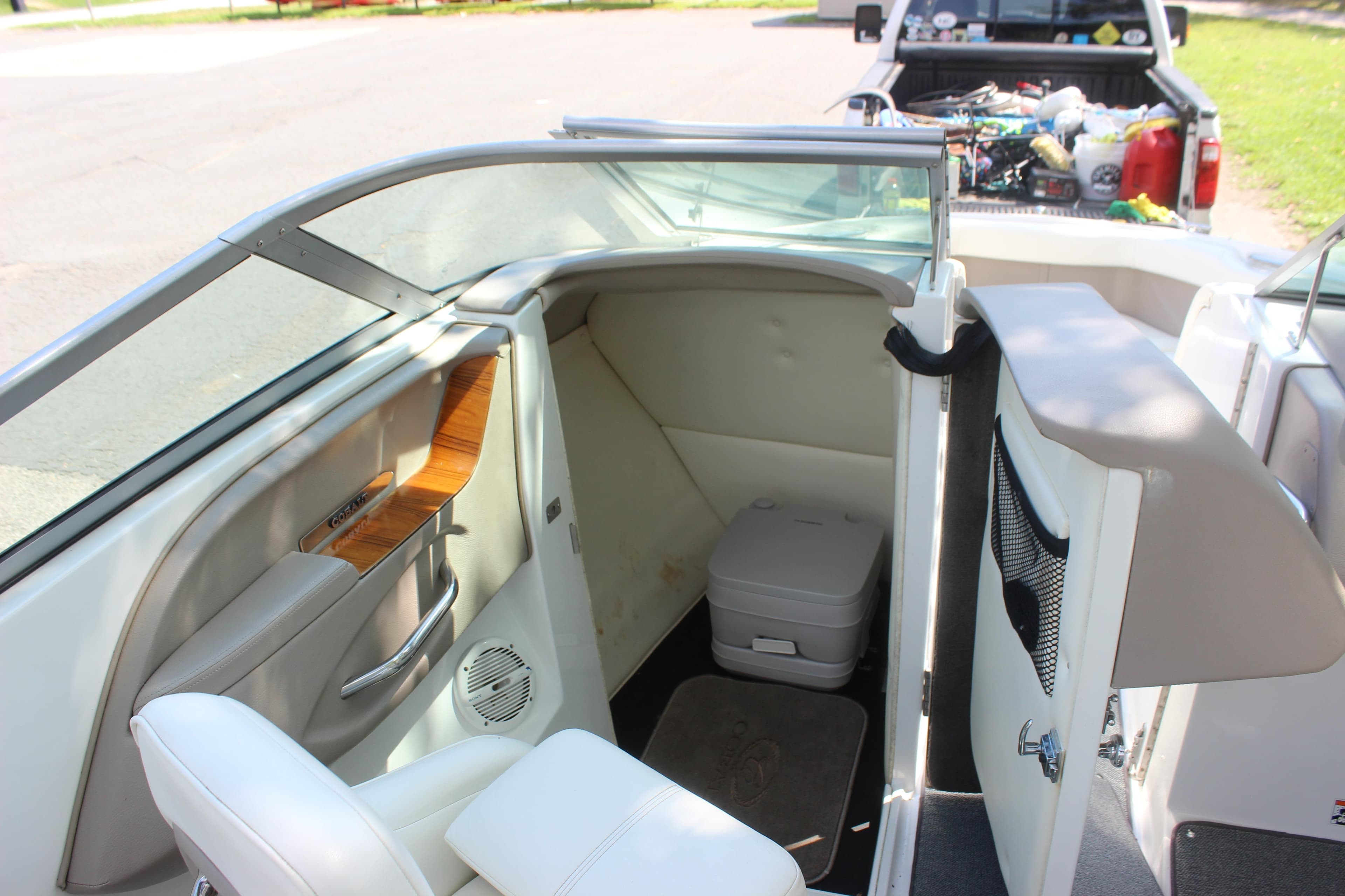2006 Cobalt 246 boat interior with seating and storage compartment.