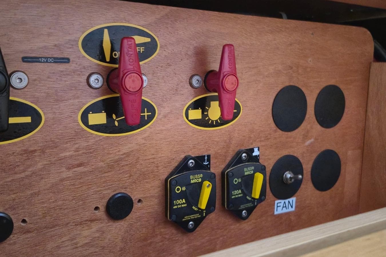 Control panel of a 2017 Lagoon 400 S2 yacht with switches and circuit breakers.