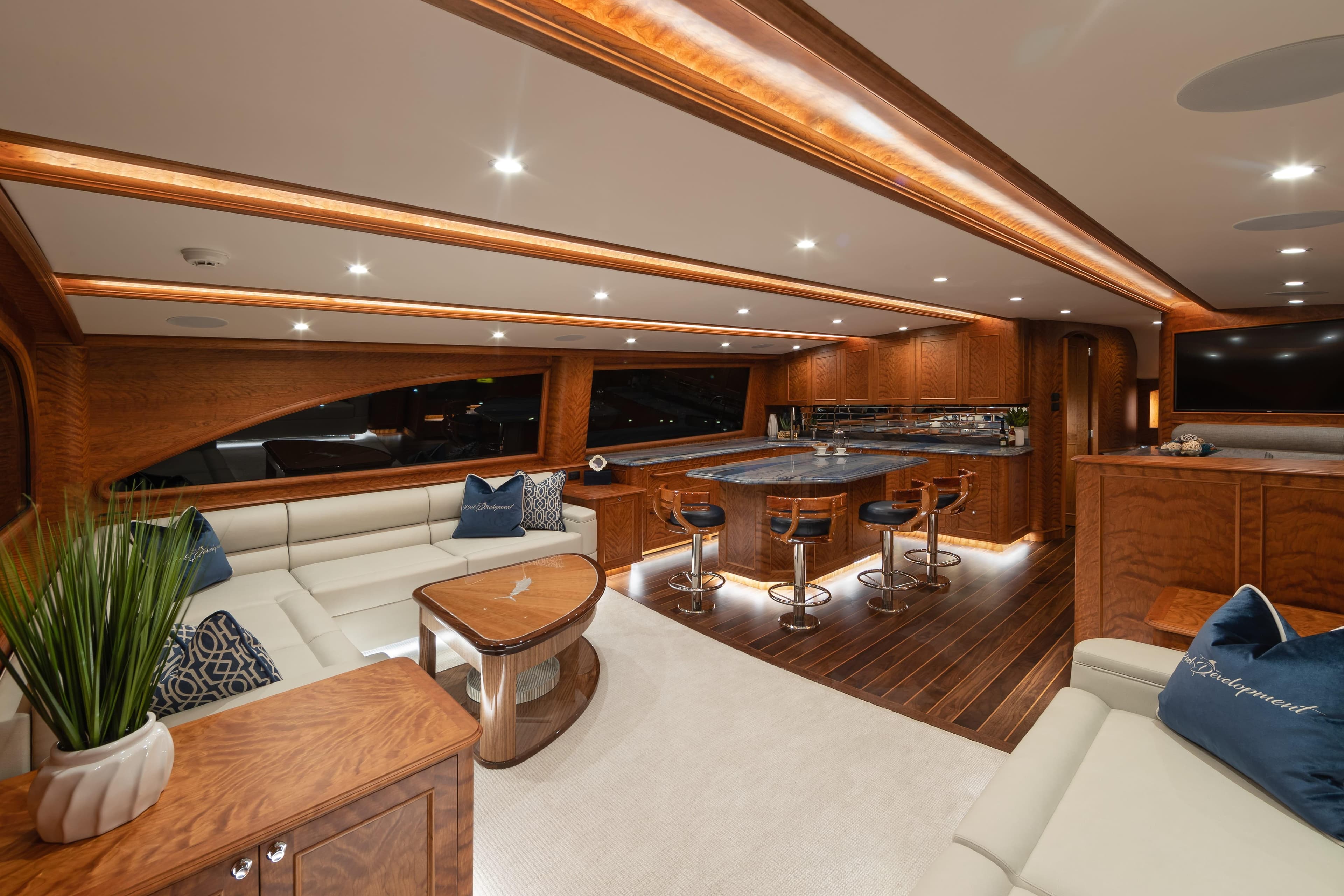 Luxurious interior of 2020 Jarrett Bay 84 yacht with elegant wood finishes and modern seating.