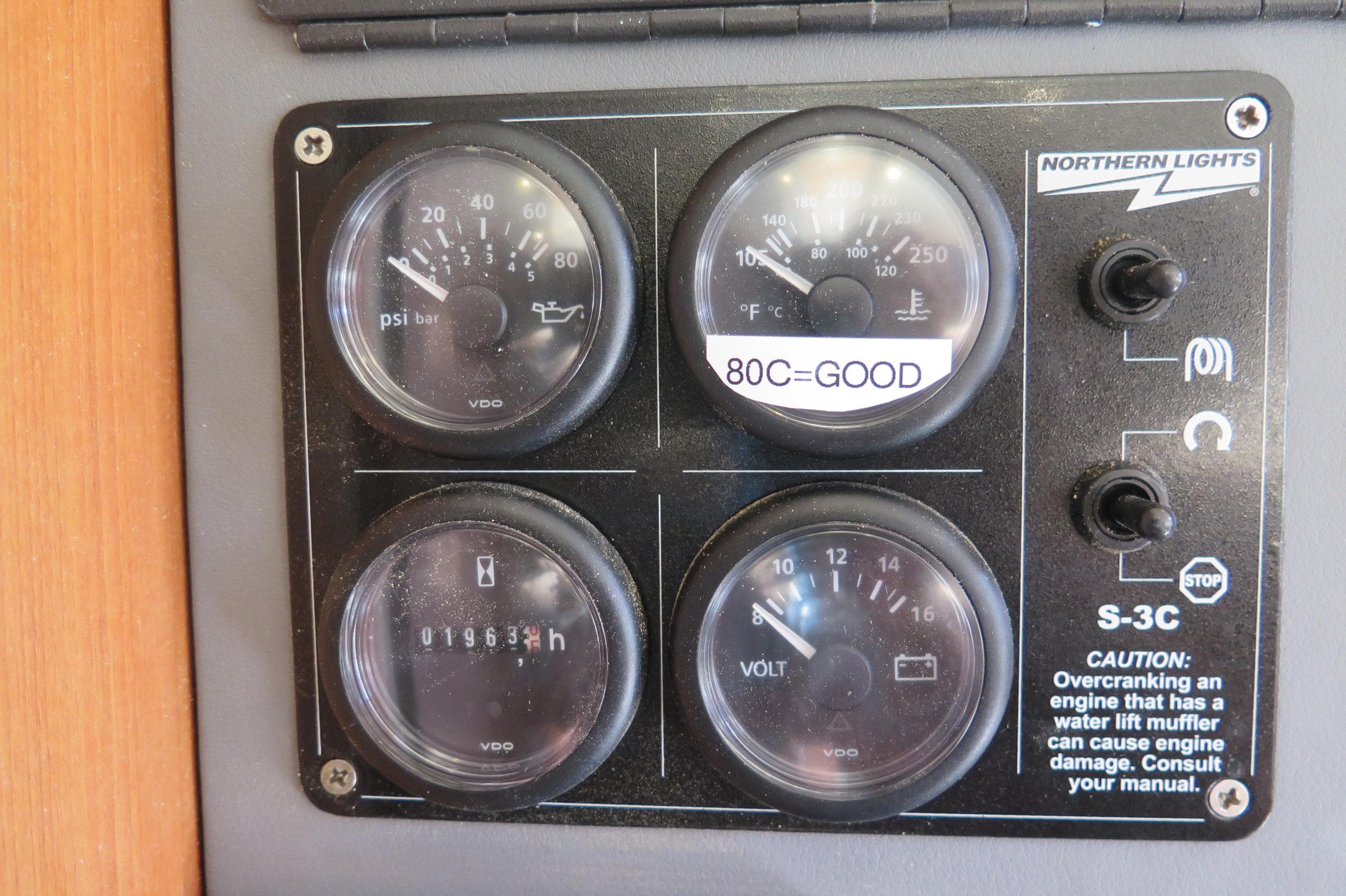 Control panel of a 2009 Leopard 46 with gauges and switches.
