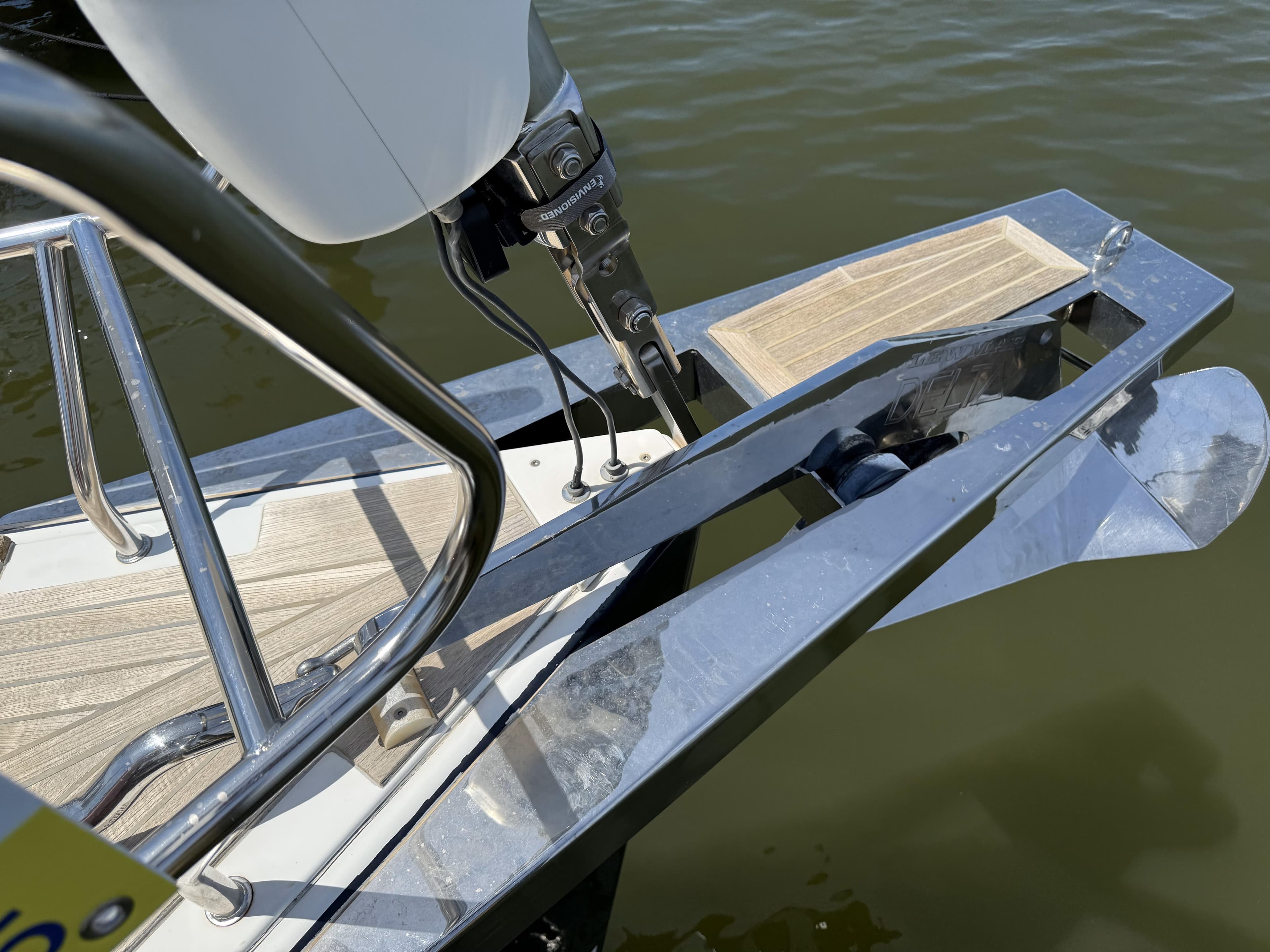 Bow of 2016 Beneteau Oceanis 60 yacht with anchor and teak decking.