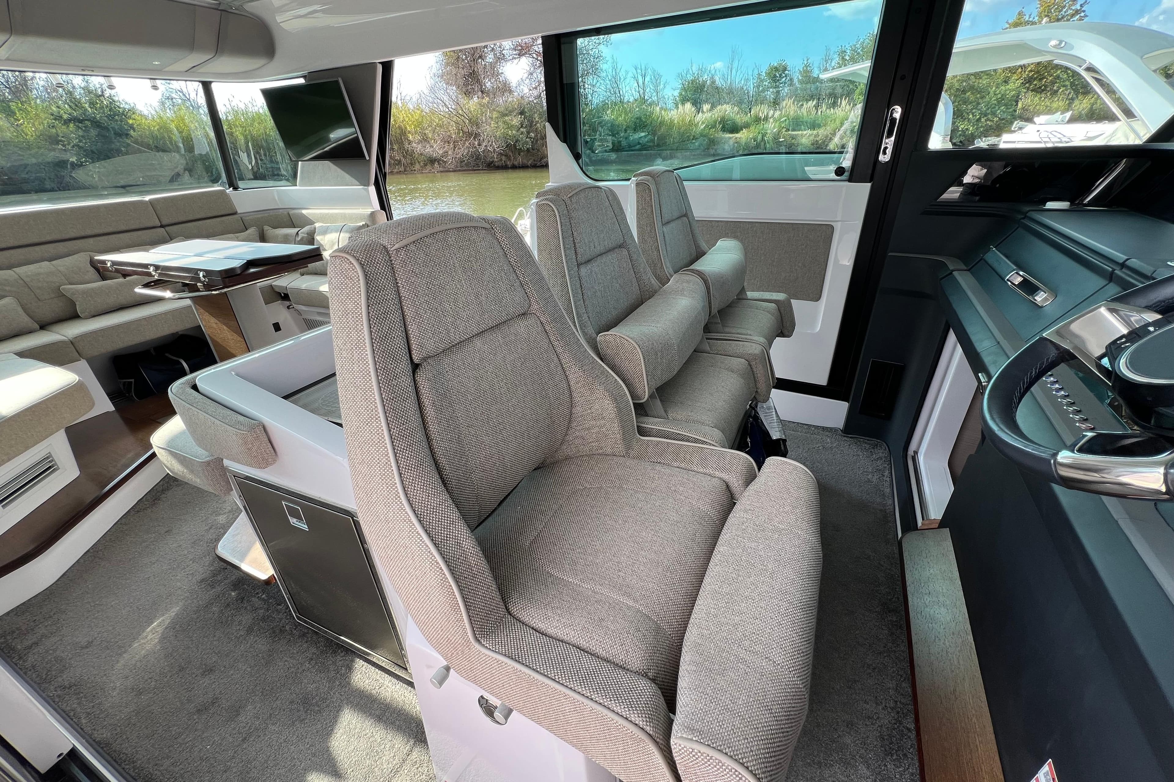 Luxurious interior of 2023 Axopar 45 Cross Cabine with plush seating and modern design.