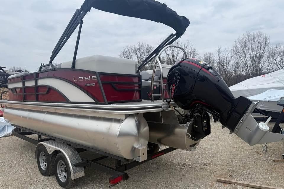 2026 Lowe SS 230 WV pontoon boat on trailer with outboard motor.