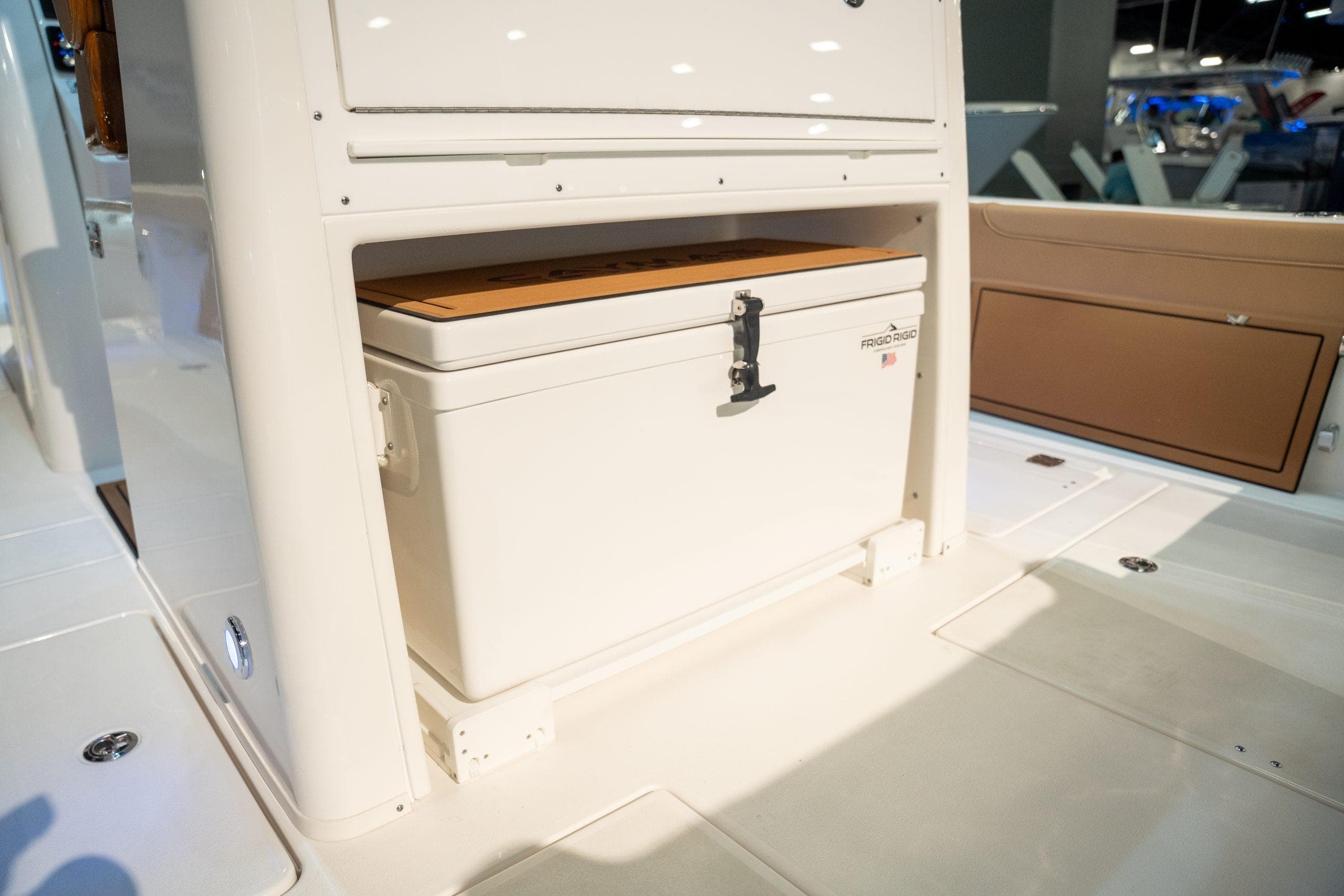 Caymas 29 CT 2027 boat with built-in cooler compartment.