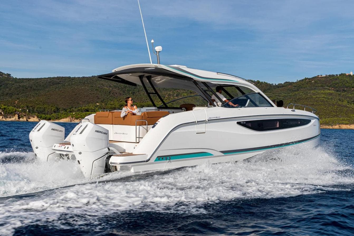 Manufacturer Provided Image: 2026 Jeanneau TH38 motor yacht cruising on open water with scenic background.