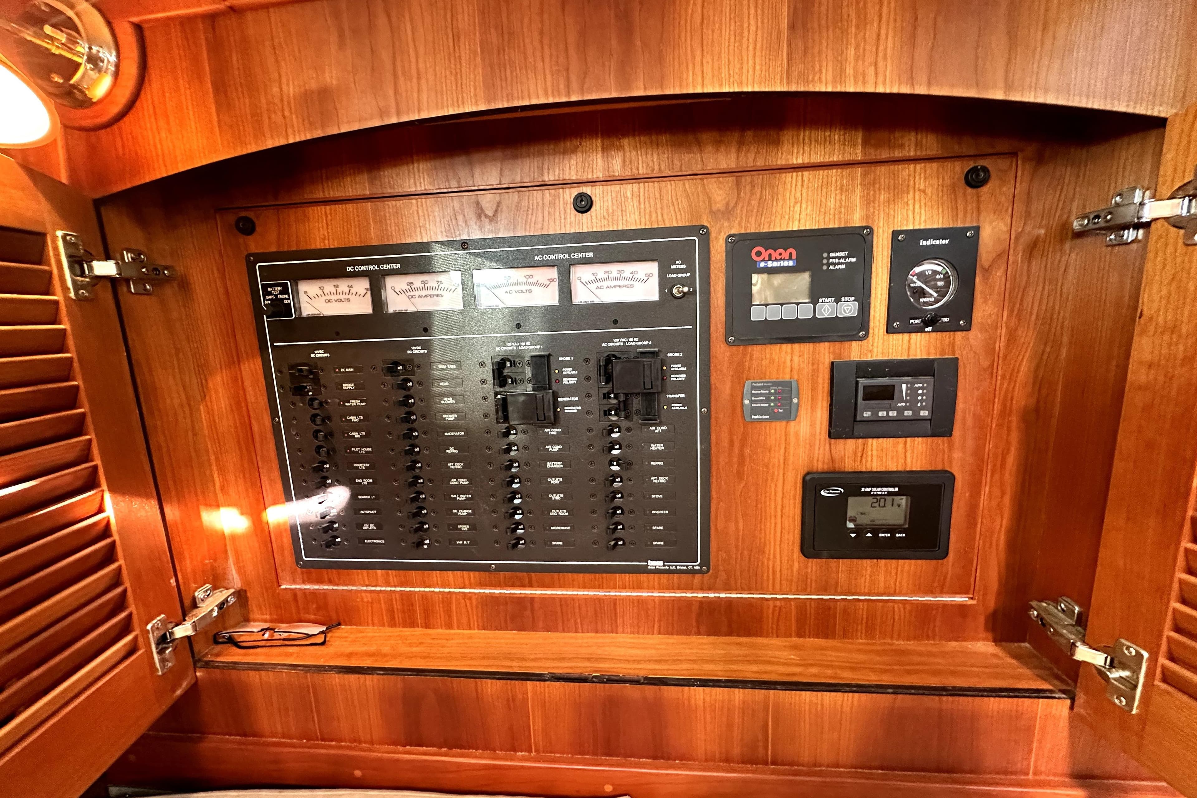 Electrical control panel inside 2007 Sabre 34 Express boat, featuring various switches and gauges.