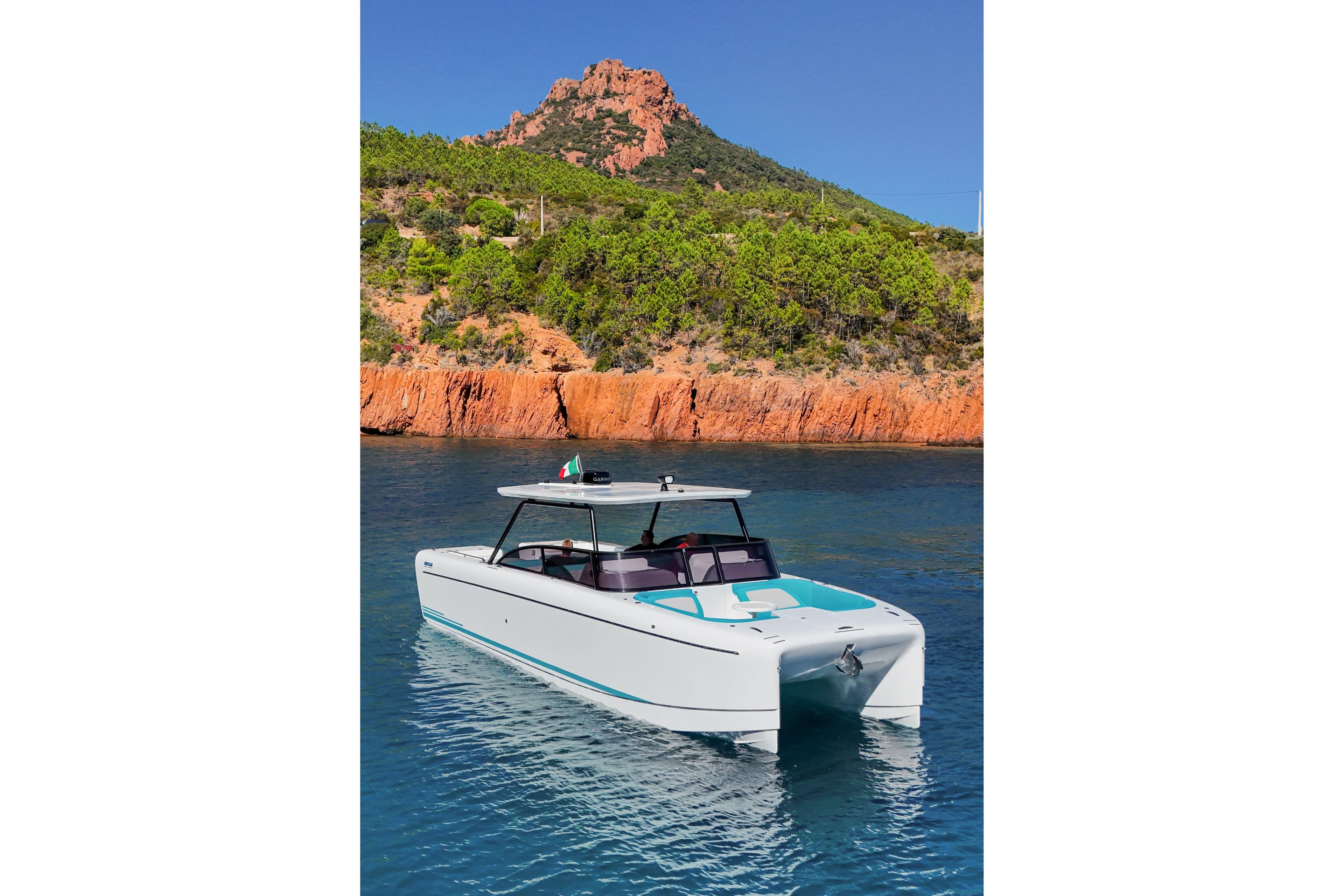2025 Canados Heritage 36 yacht in scenic coastal waters with rocky cliffs.