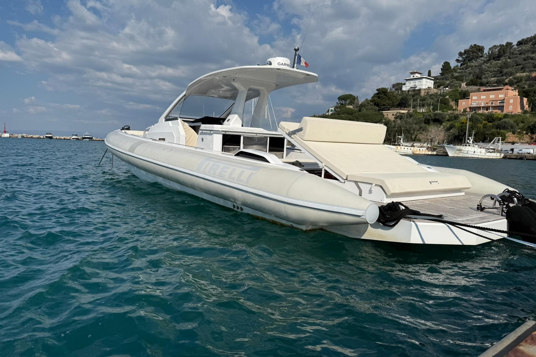 Luxury Pirelli 42 yacht on serene blue waters, 2022 model.