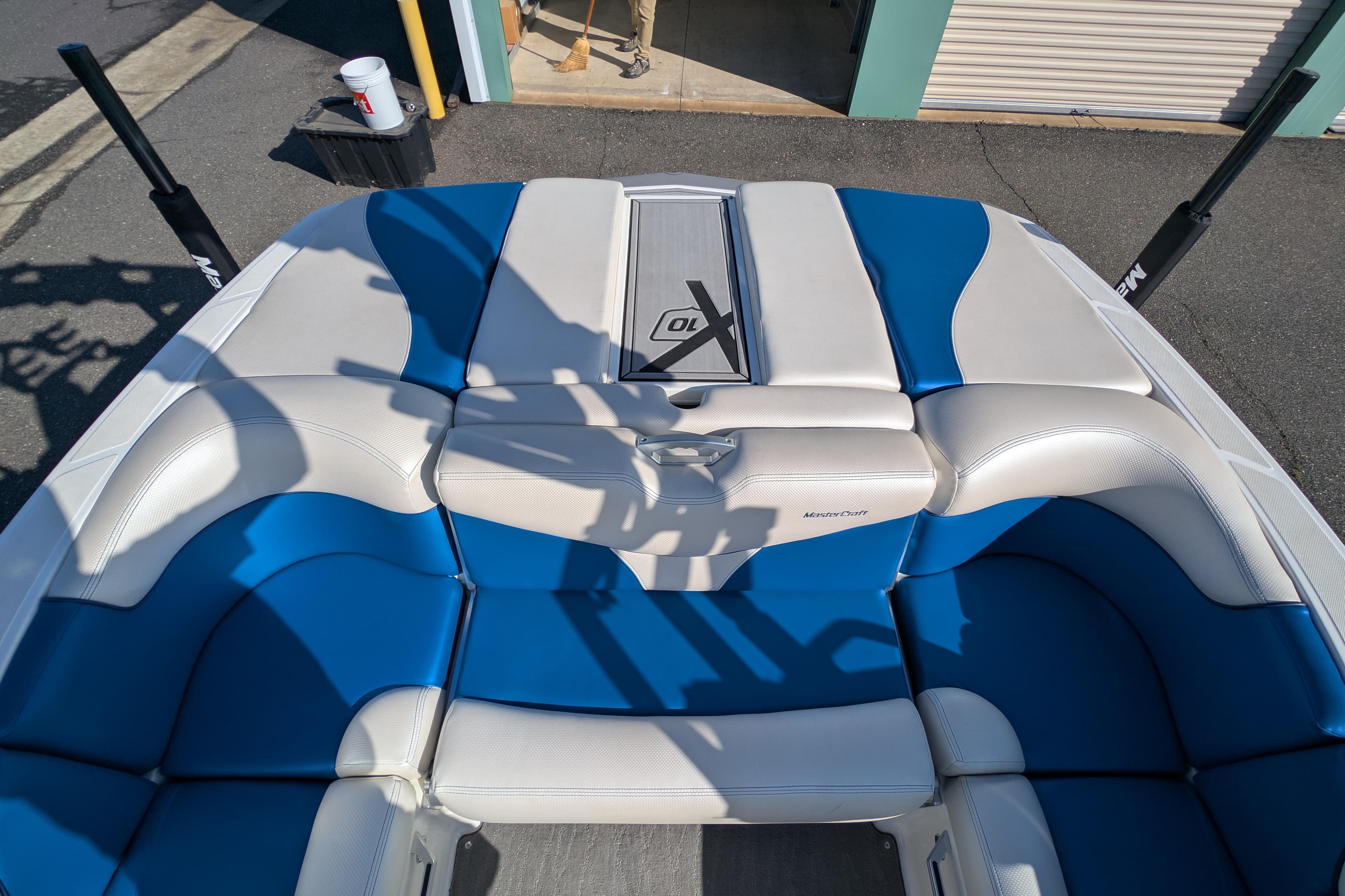 2016 MasterCraft X10 boat interior with blue and white seating.