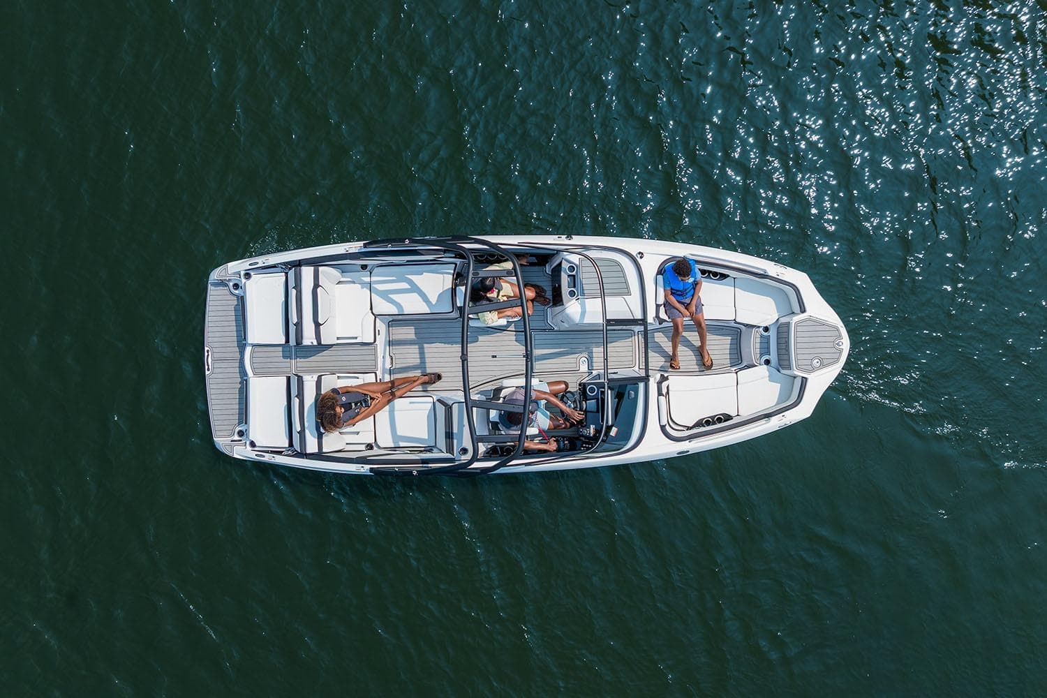 Manufacturer Provided Image: Aerial view of 2026 Yamaha Boats 252S on water with passengers relaxing.
