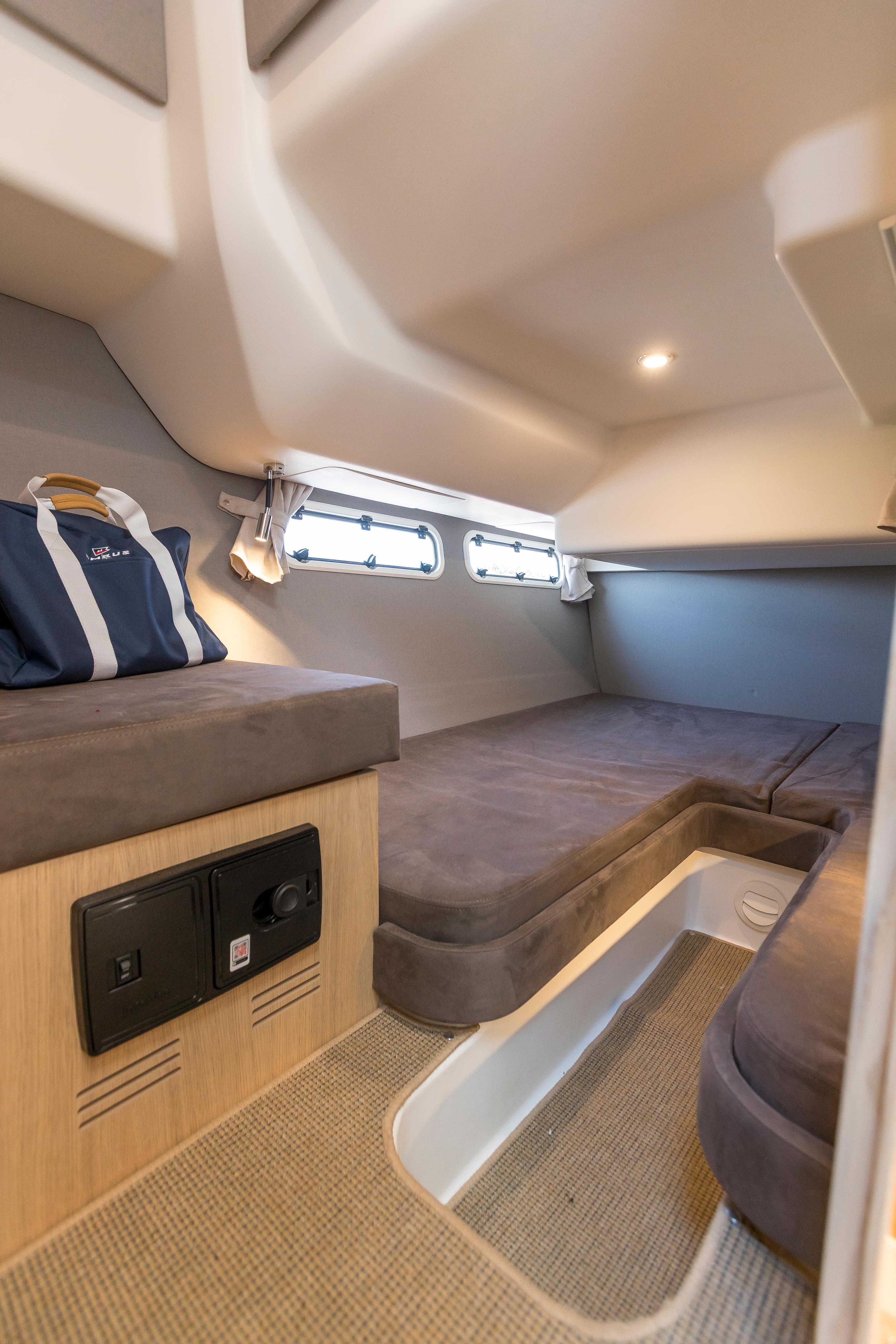 Interior cabin of 2024 Nimbus 405 Coupé, featuring cozy seating and modern design.