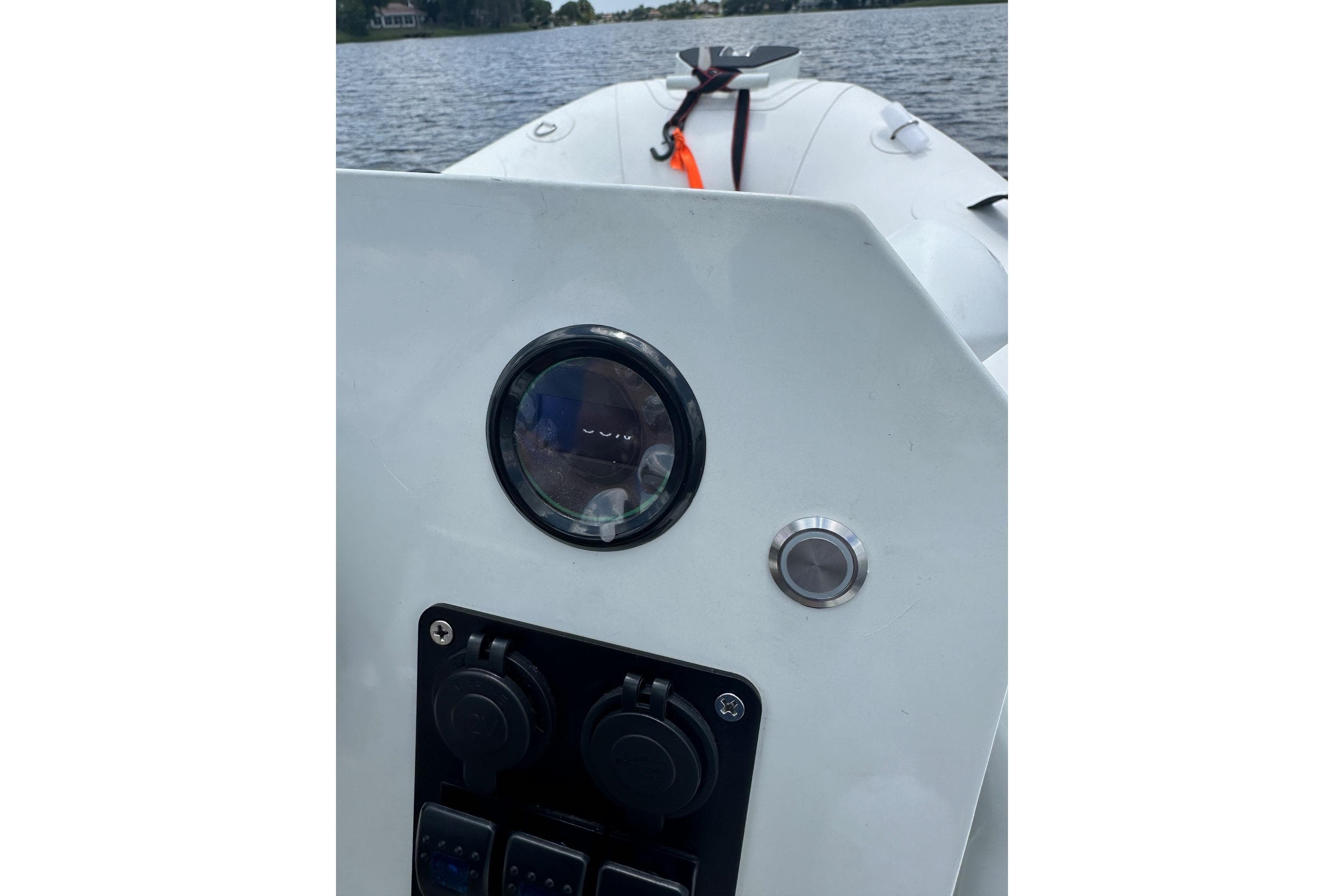 2026 East Marine NEW 320 boat dashboard with Linergy electric motor on a lake.