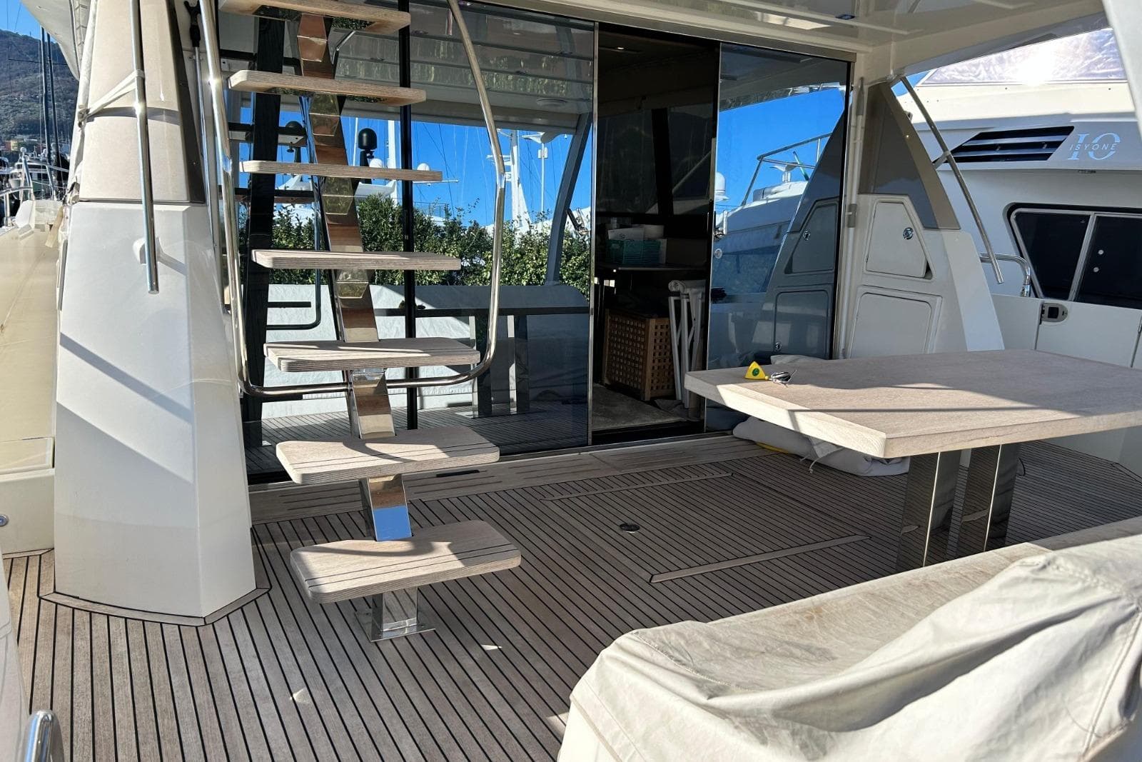 Luxury 2017 Prestige 680 yacht deck with modern staircase and seating area.