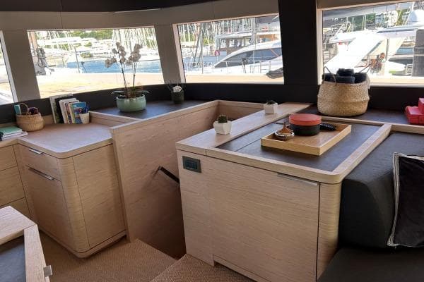 Luxurious interior of 2023 Lagoon Seventy 7 yacht with modern decor and ample natural light.