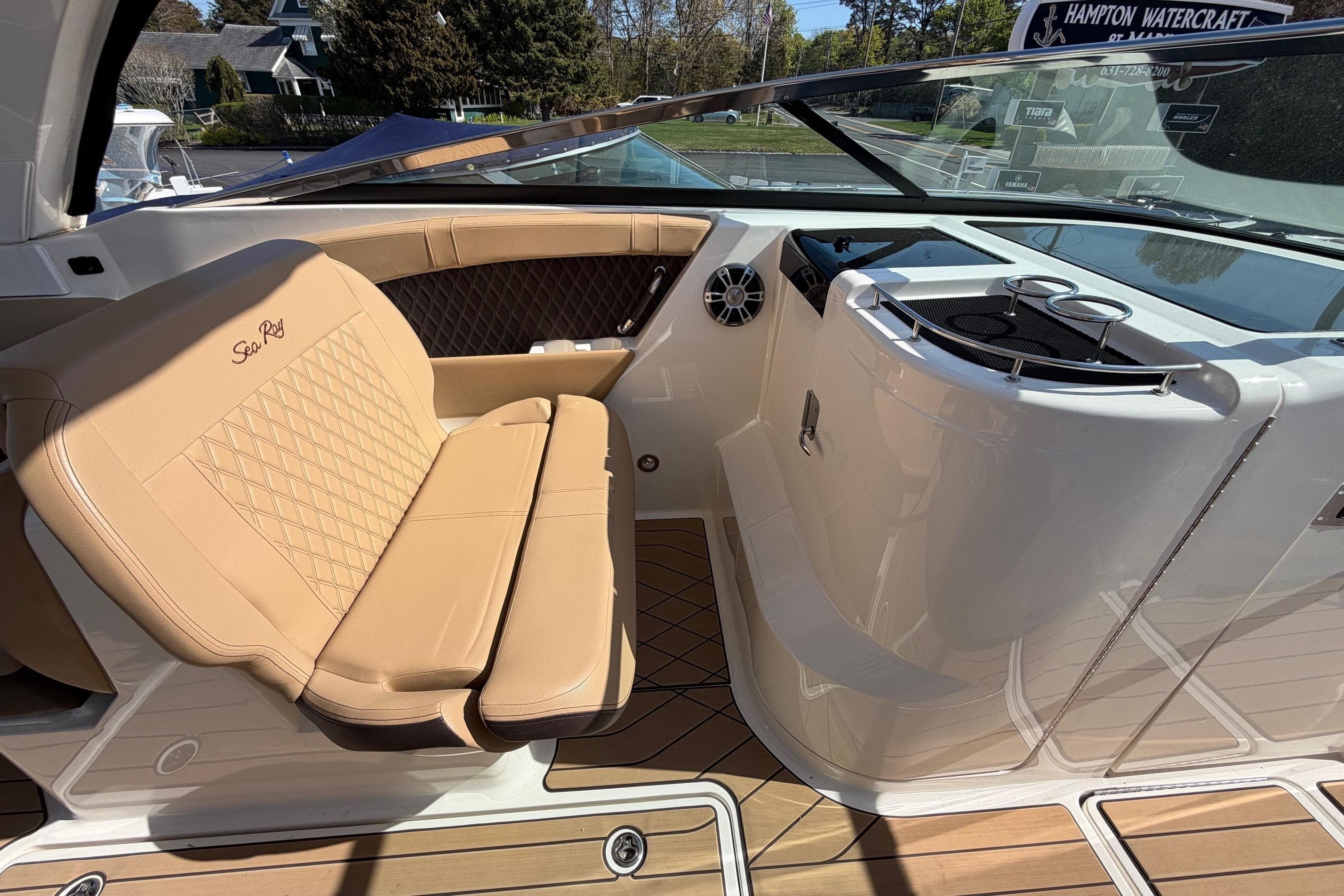 2023 Sea Ray SLX 350 Outboard interior with tan seating and sleek design.