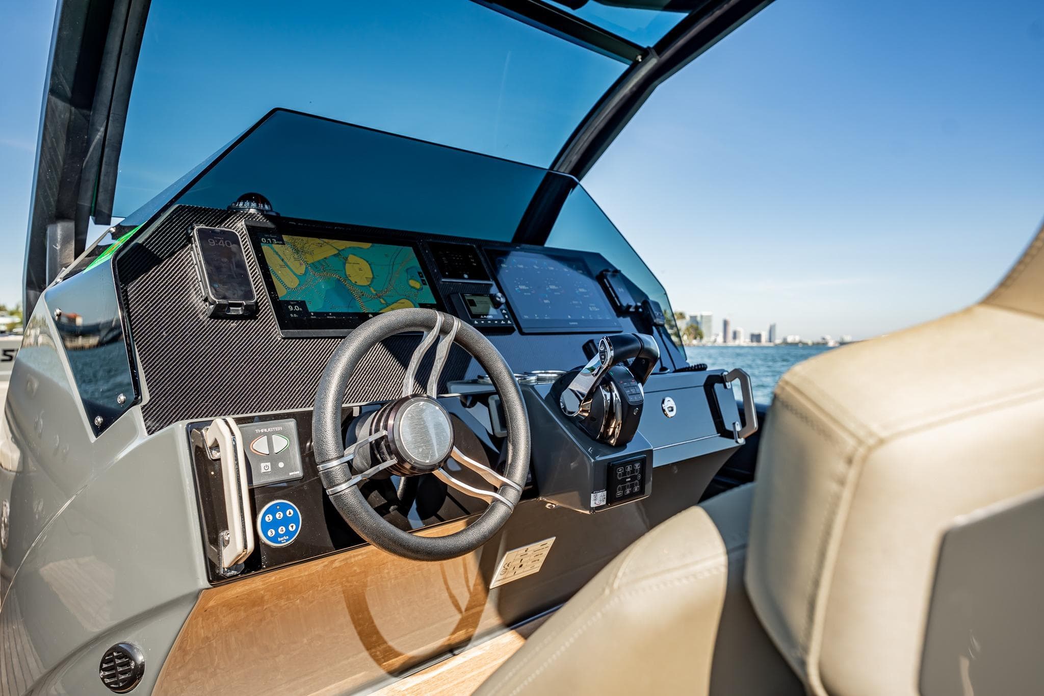 2023 Skipper-BSK 38NC boat dashboard with navigation system and steering wheel.