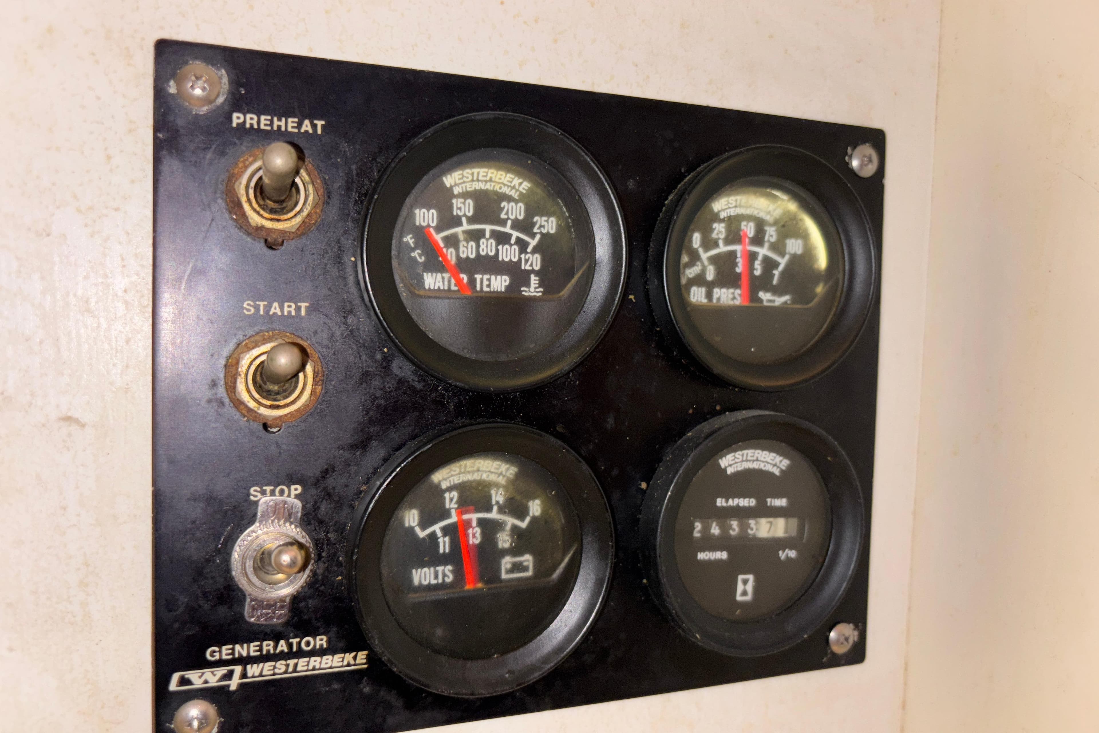Westerbeke generator control panel with gauges on a 2001 Silverton 410 Sport Bridge.