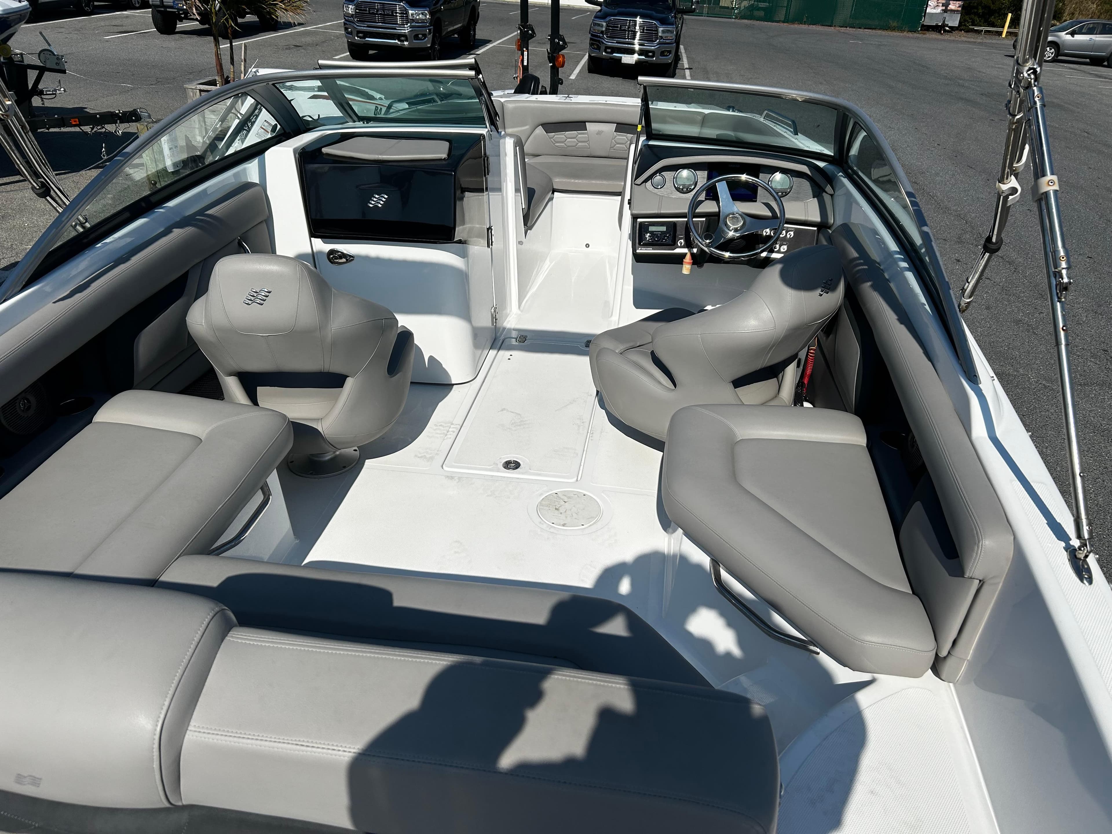 2023 Four Winns HD3 OB boat interior with gray seating and steering console.