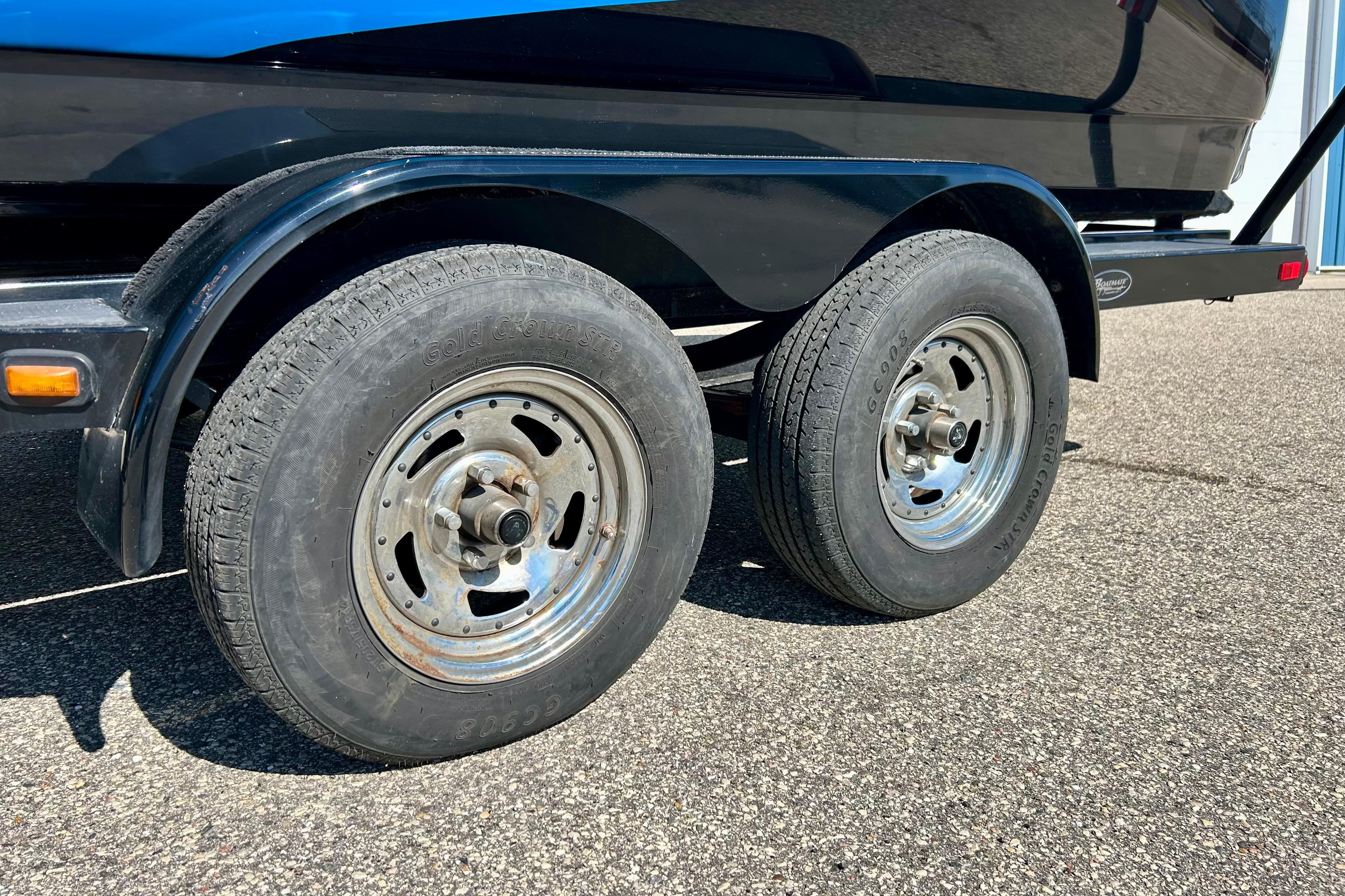 2012 Moomba Mojo 2.5 trailer with dual wheels on asphalt surface.