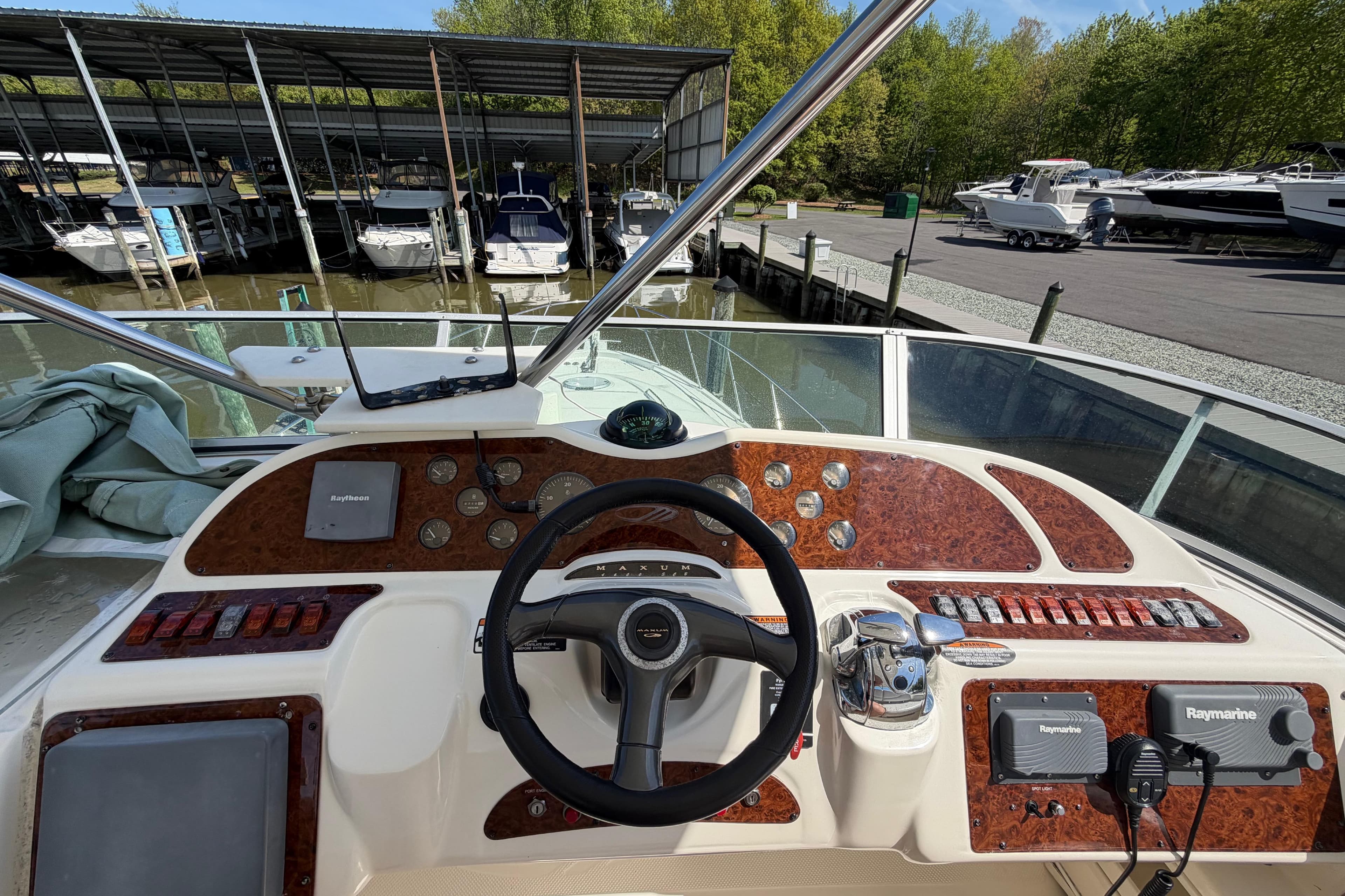 Helm of 2001 Maxum 4600 SCB Limited Edition yacht with Raymarine navigation system.