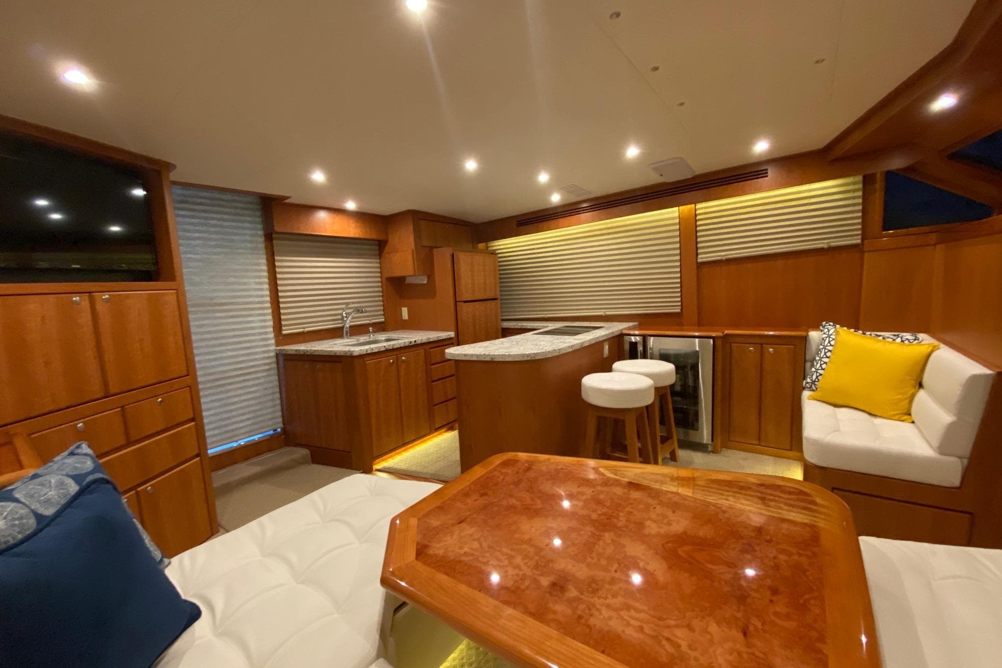 Luxurious interior of 2026 Mikelson 45 Gen III Sportfish yacht with modern kitchen and seating.