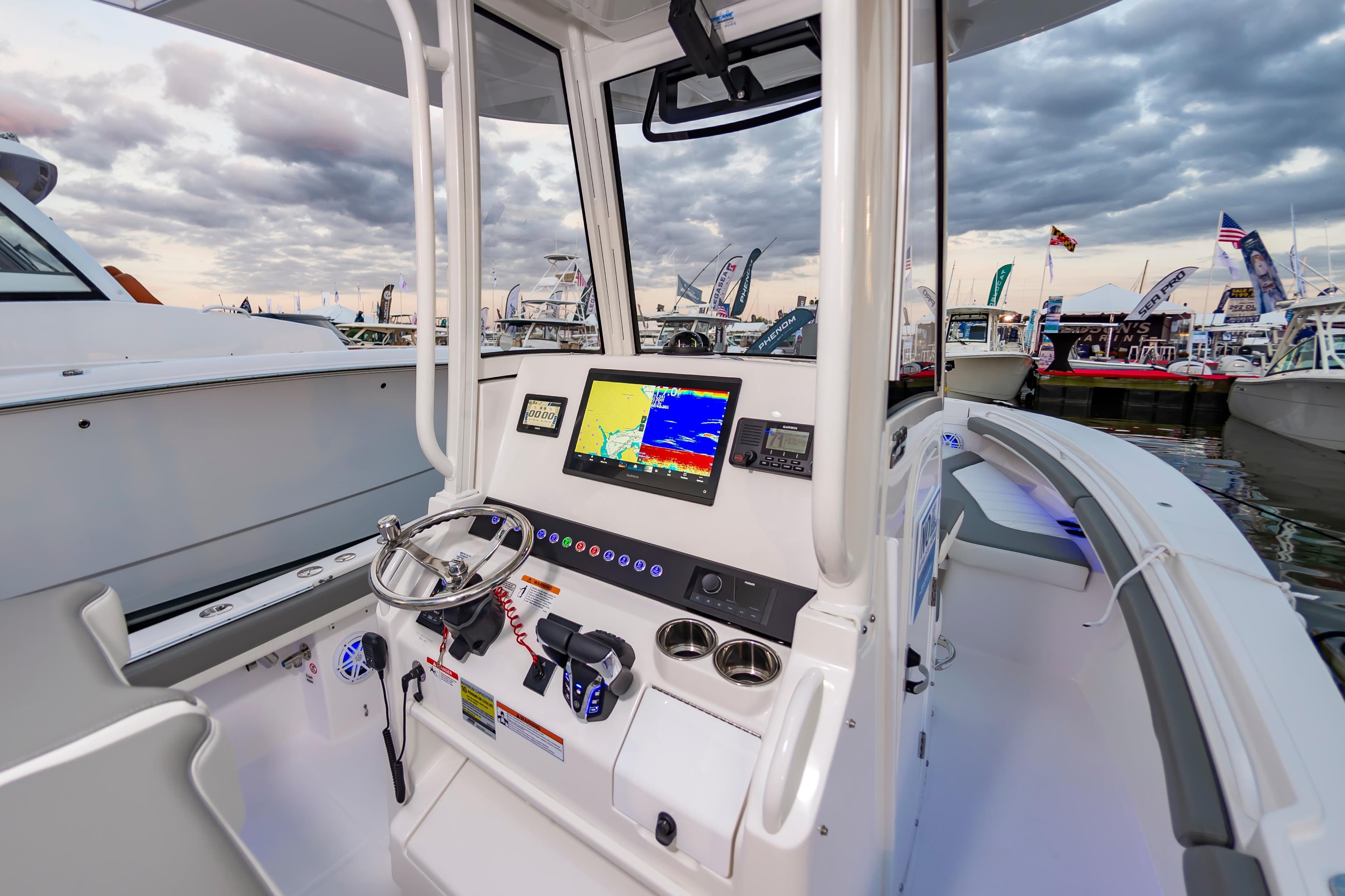 2025 Regulator 23 boat cockpit with advanced navigation system at marina.