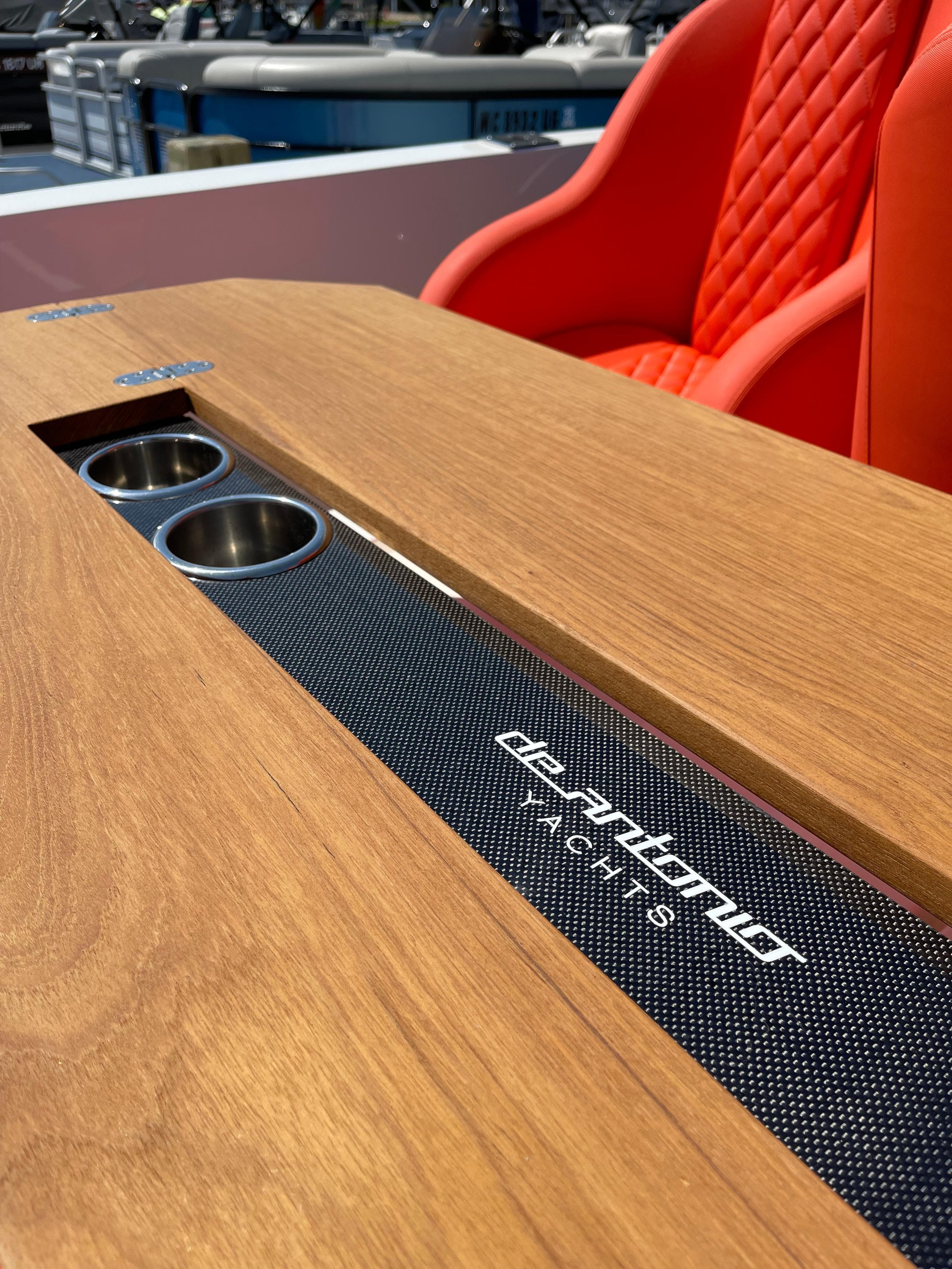 De Antonio Yachts D 28 2020 model with wooden table and red seats.