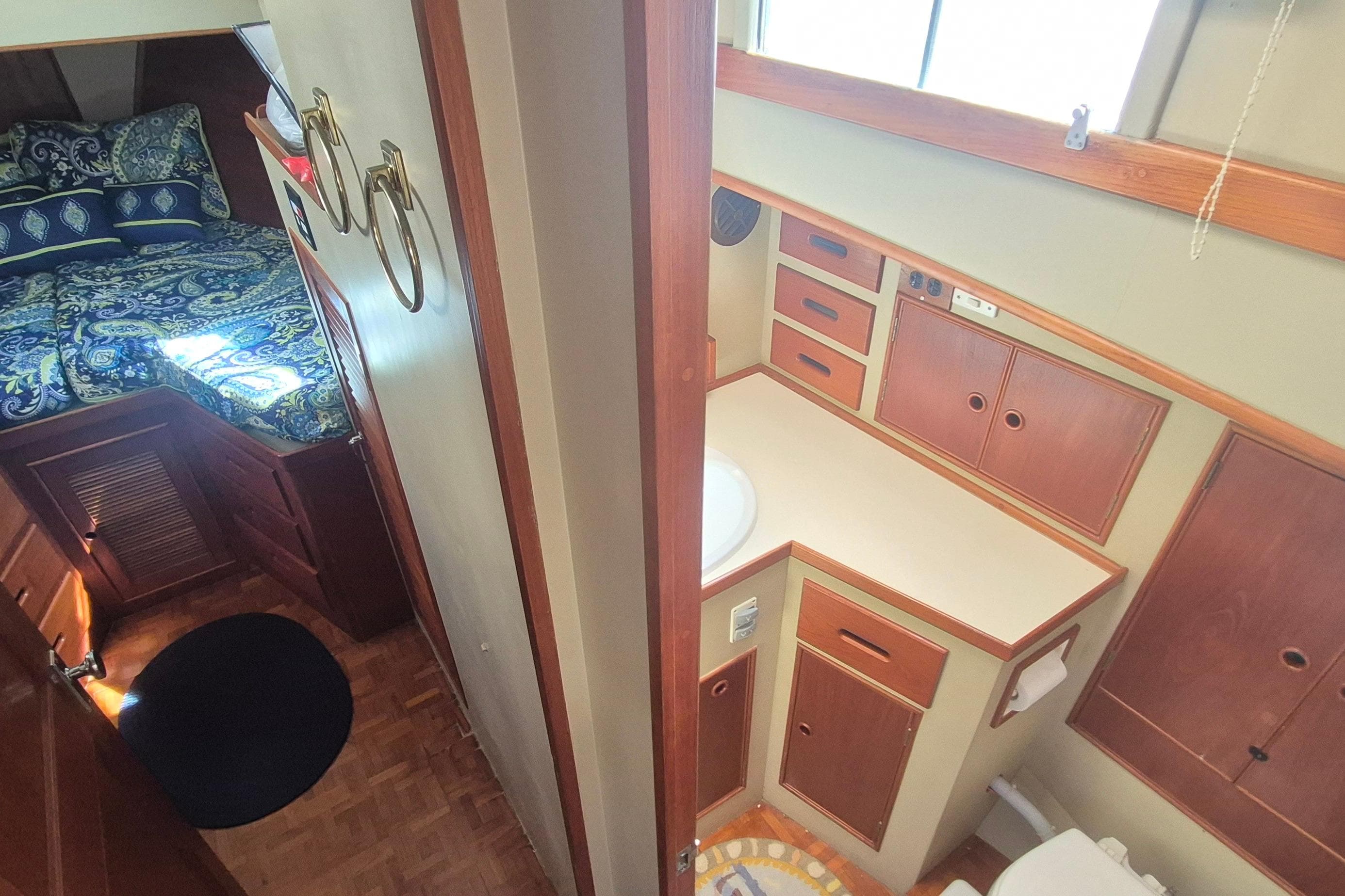 1983 Grand Banks 42 Motoryacht interior with cozy bedroom and compact bathroom.