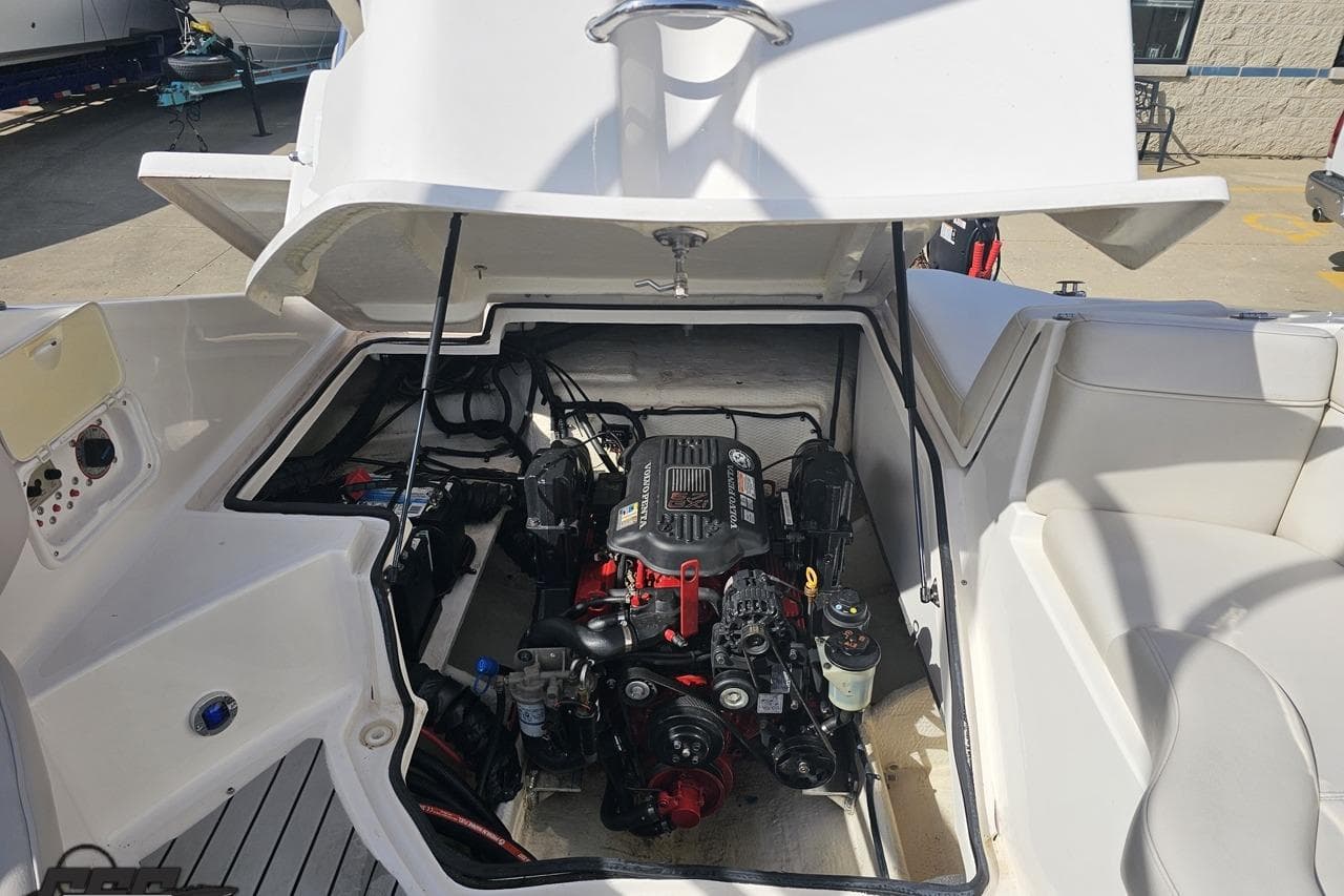 2008 Regal 2520 FasDeck boat engine compartment with open hatch, showcasing engine details.