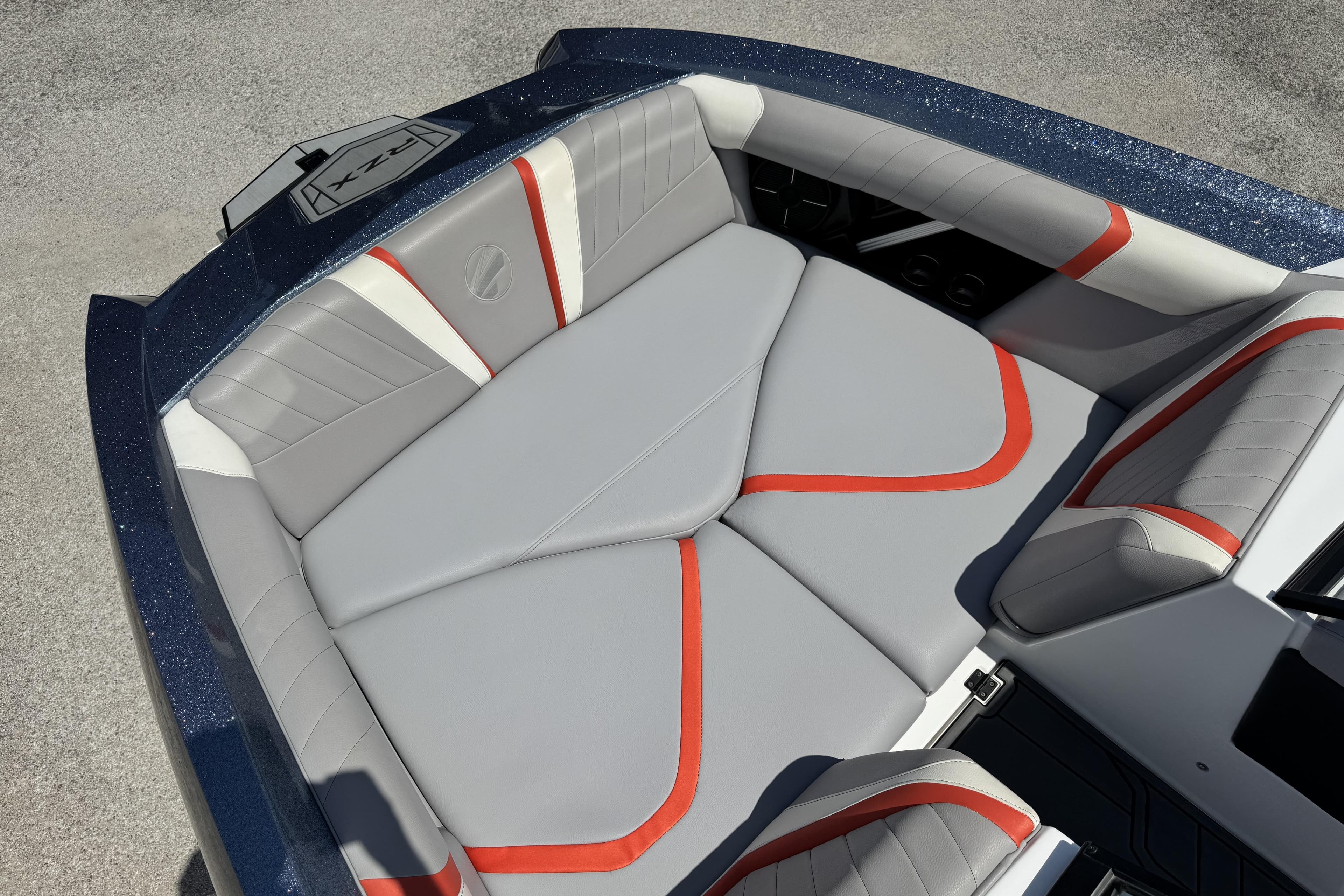2021 Tigé 23RZX boat interior with gray and red seating, sleek design.