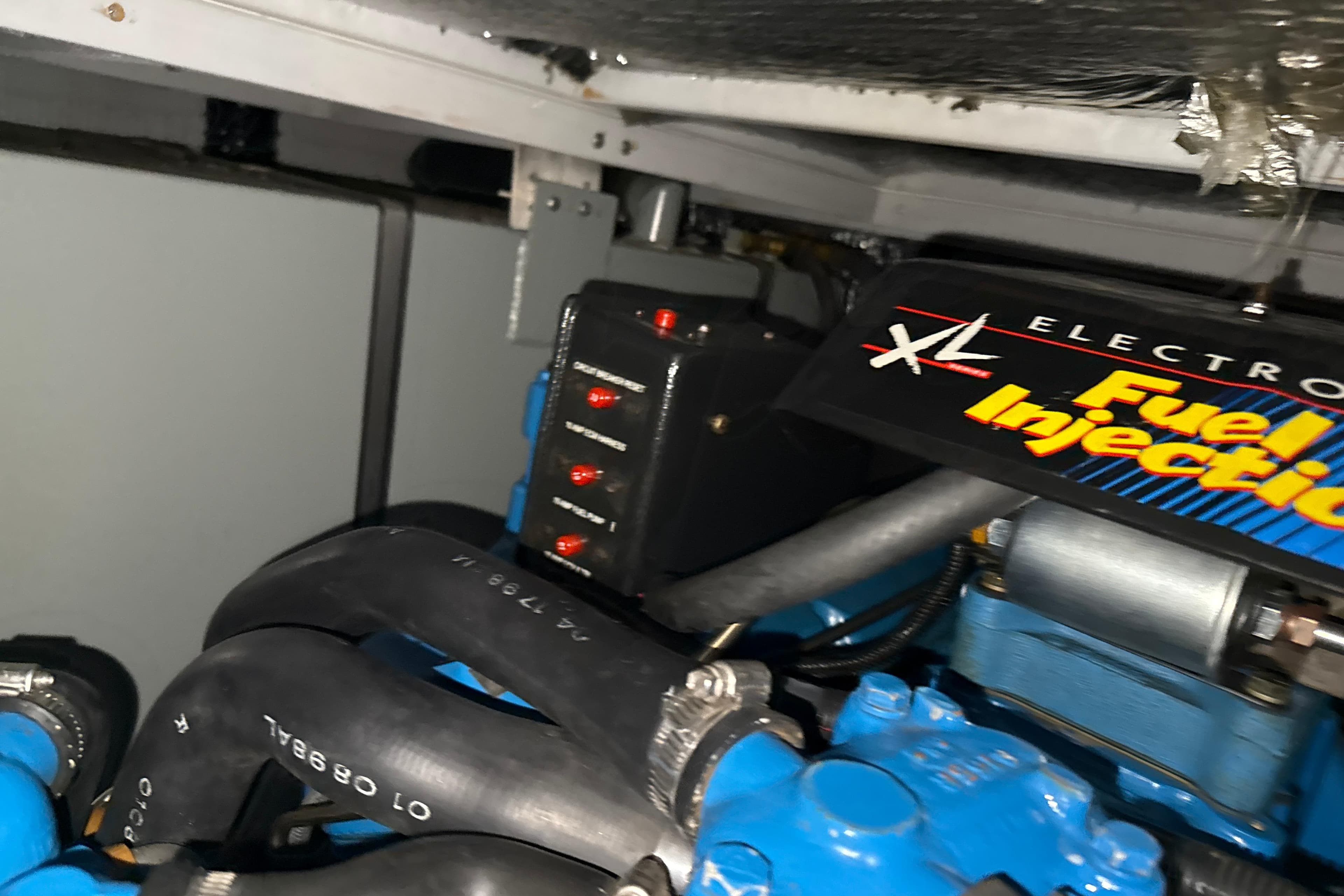 Engine compartment of a 1999 Silverton 422 Motor Yacht with fuel injection system.