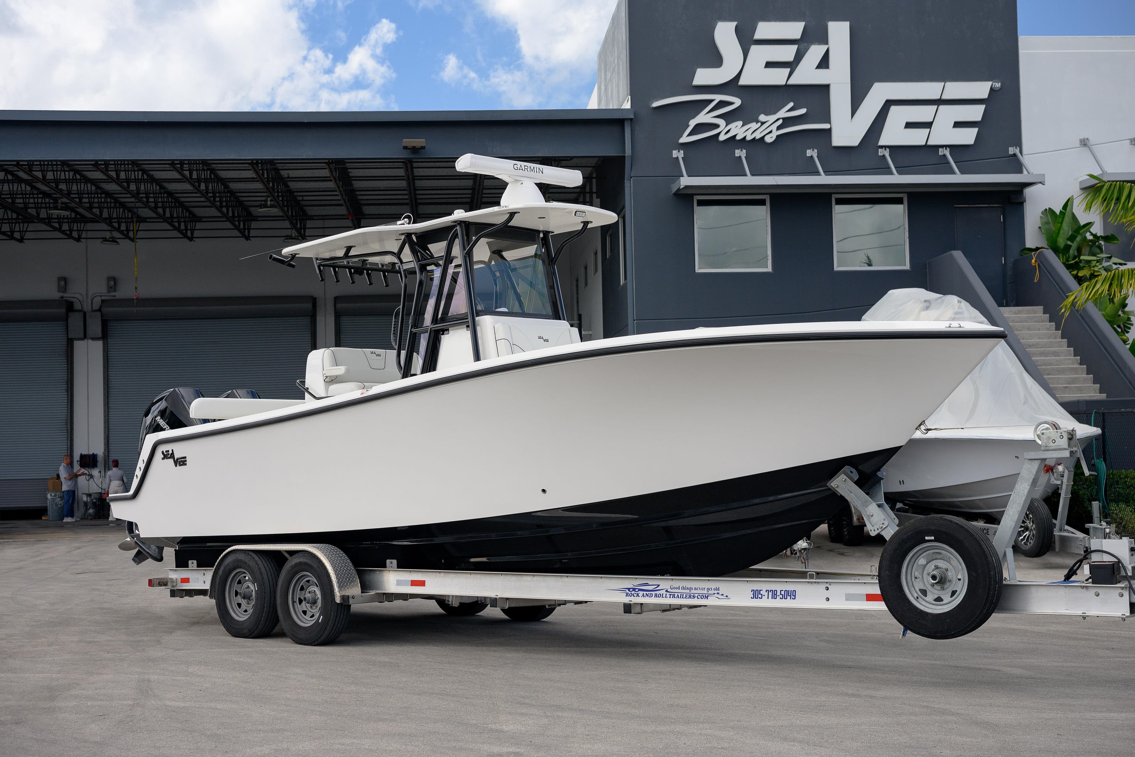 2025 SeaVee 290B boat on trailer outside SeaVee Boats facility.