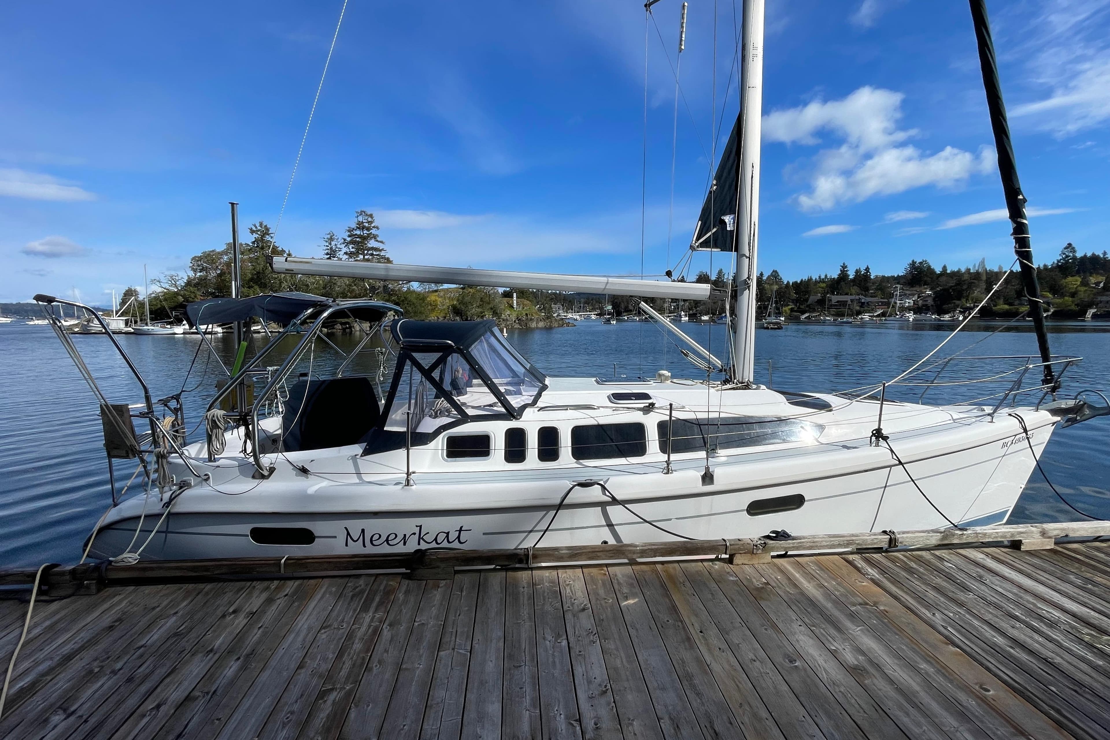 Hunter 340 sailboat named "Meerkat" docked on a sunny day, 2000 model.