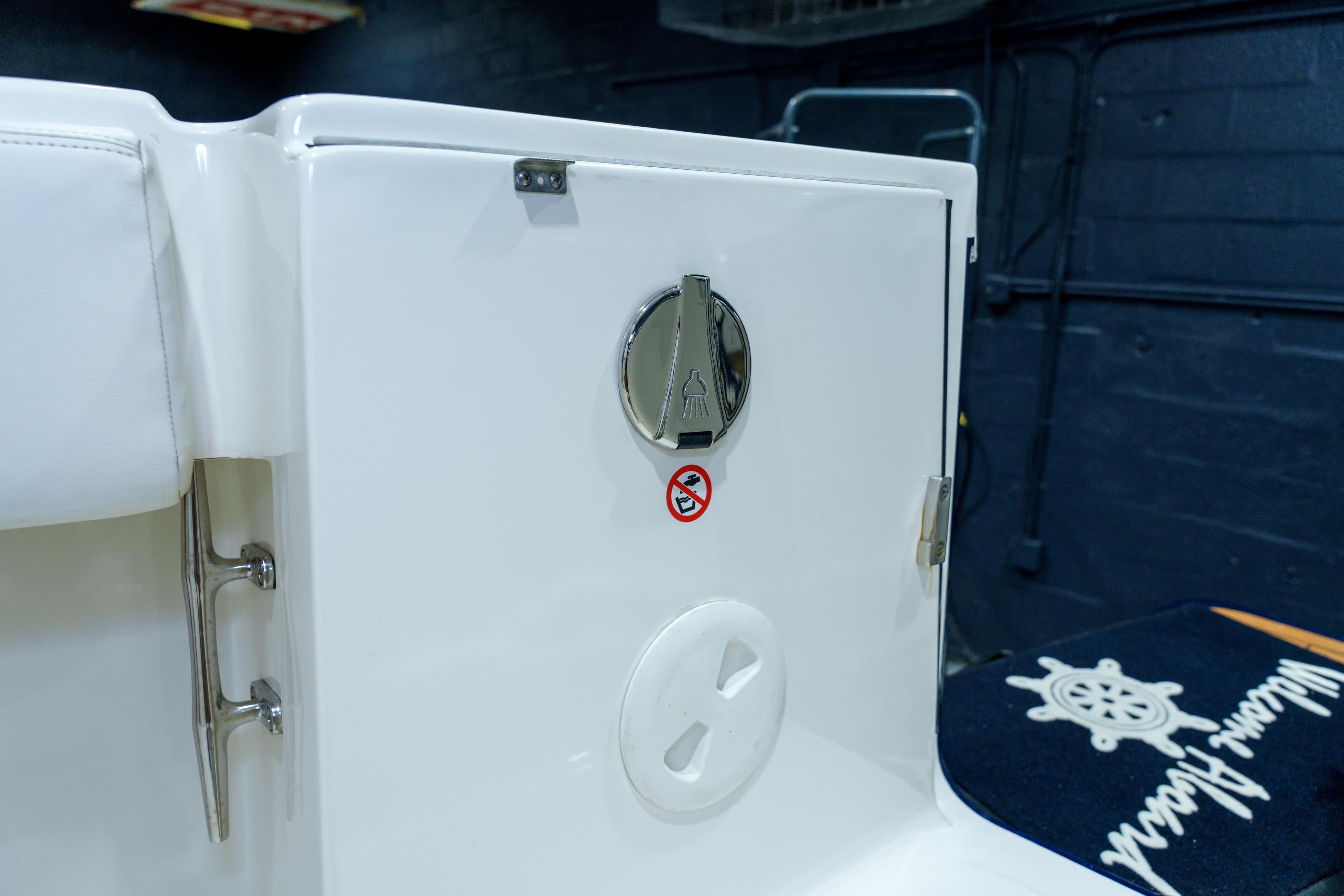 2023 Regulator 28 boat interior detail with storage compartment and nautical decor.
