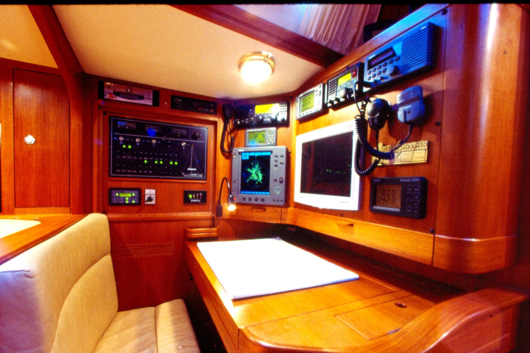 Navigation station inside a 2001 Baltic 52 yacht, featuring advanced marine electronics.