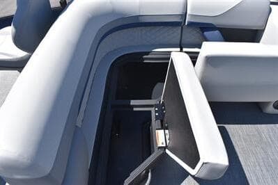 2026 Lowe SF 212 Sport Fish boat interior with open storage compartment and cushioned seating.