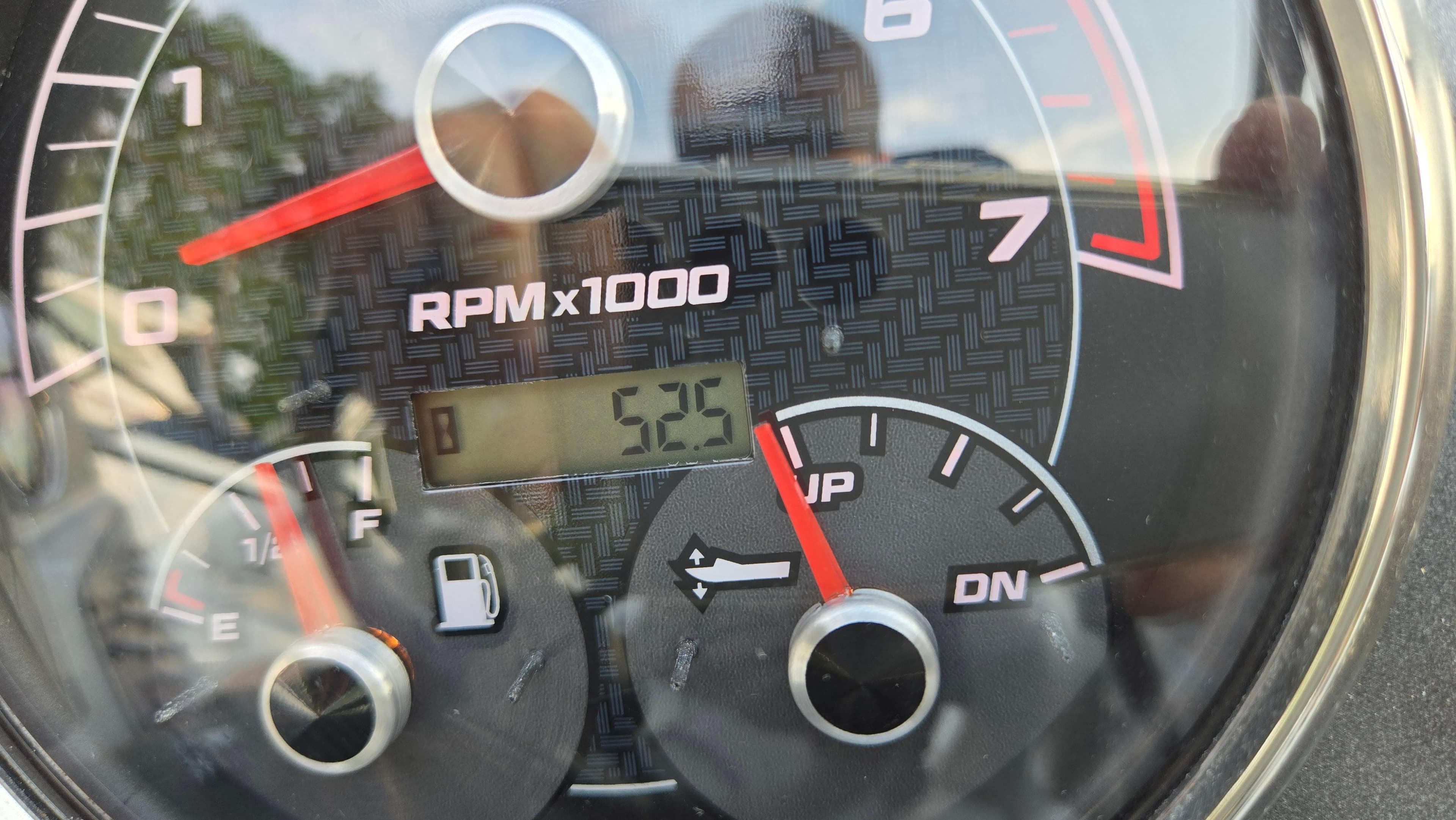 Close-up of a 2022 Hurricane SunDeck 191 OB tachometer showing 5.25 RPM x 1000.