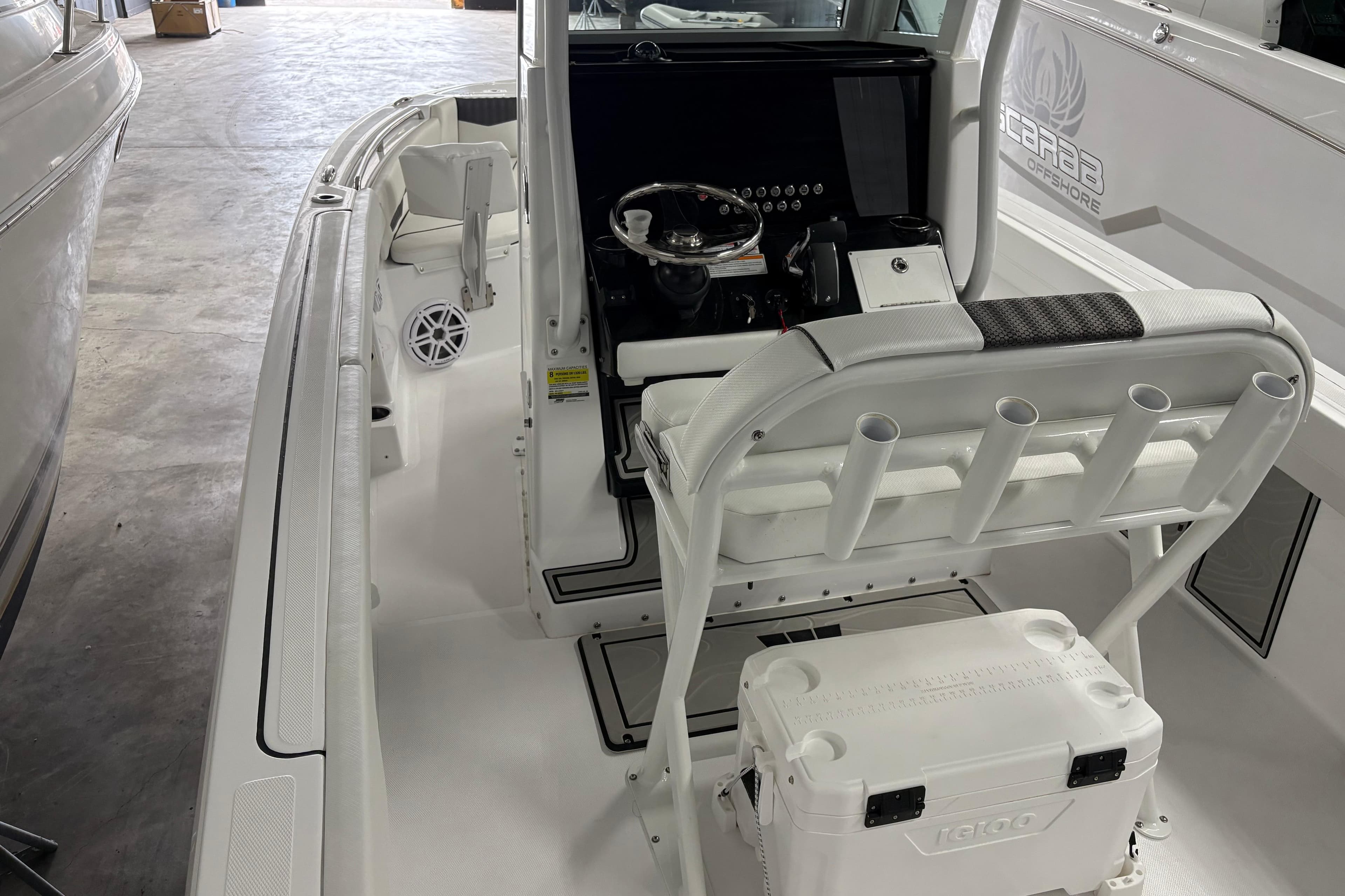 2025 Wellcraft 223 Fisherman boat interior with helm and seating area.