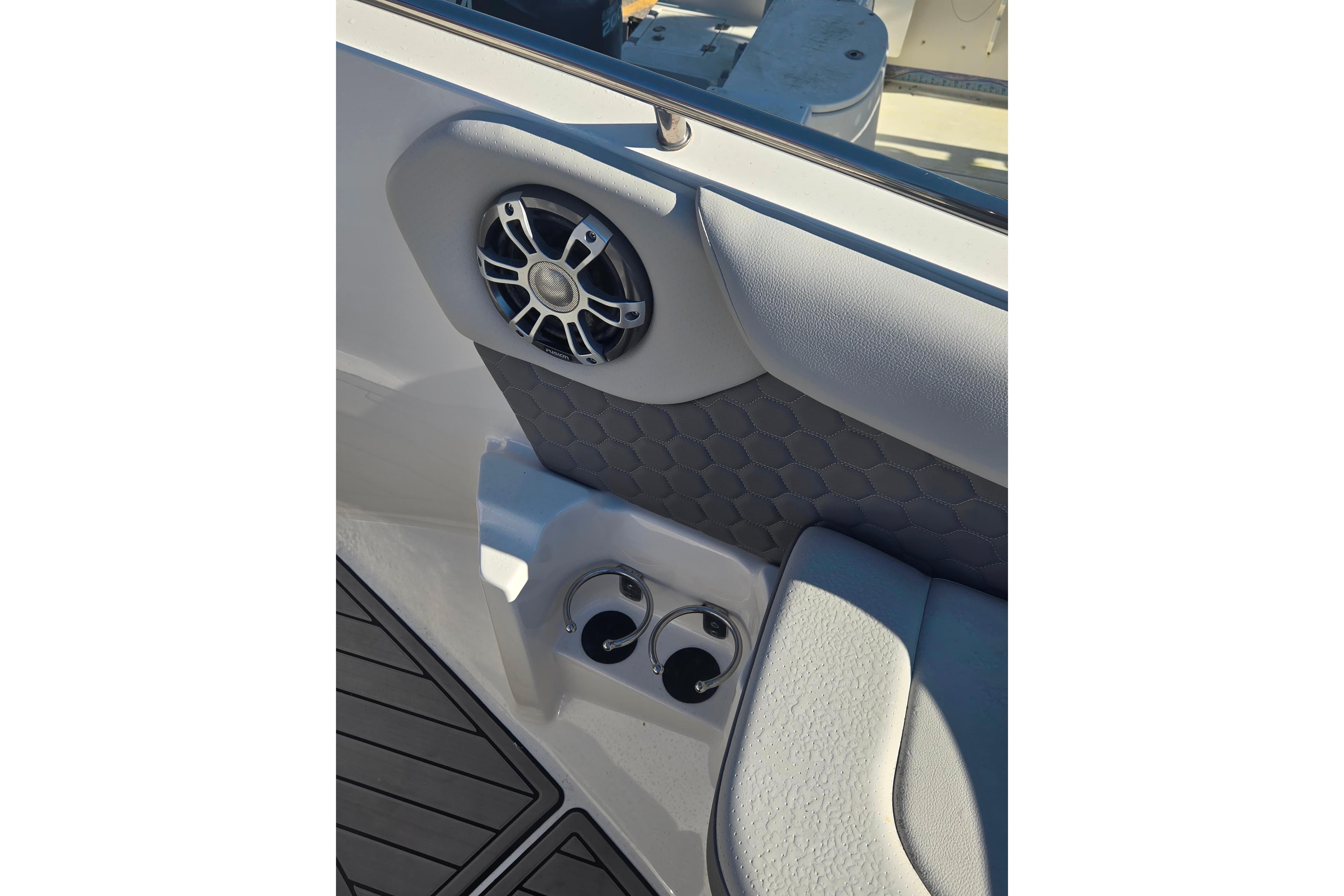 2024 Sea Ray SDX 250 Outboard interior with speaker and cup holders.
