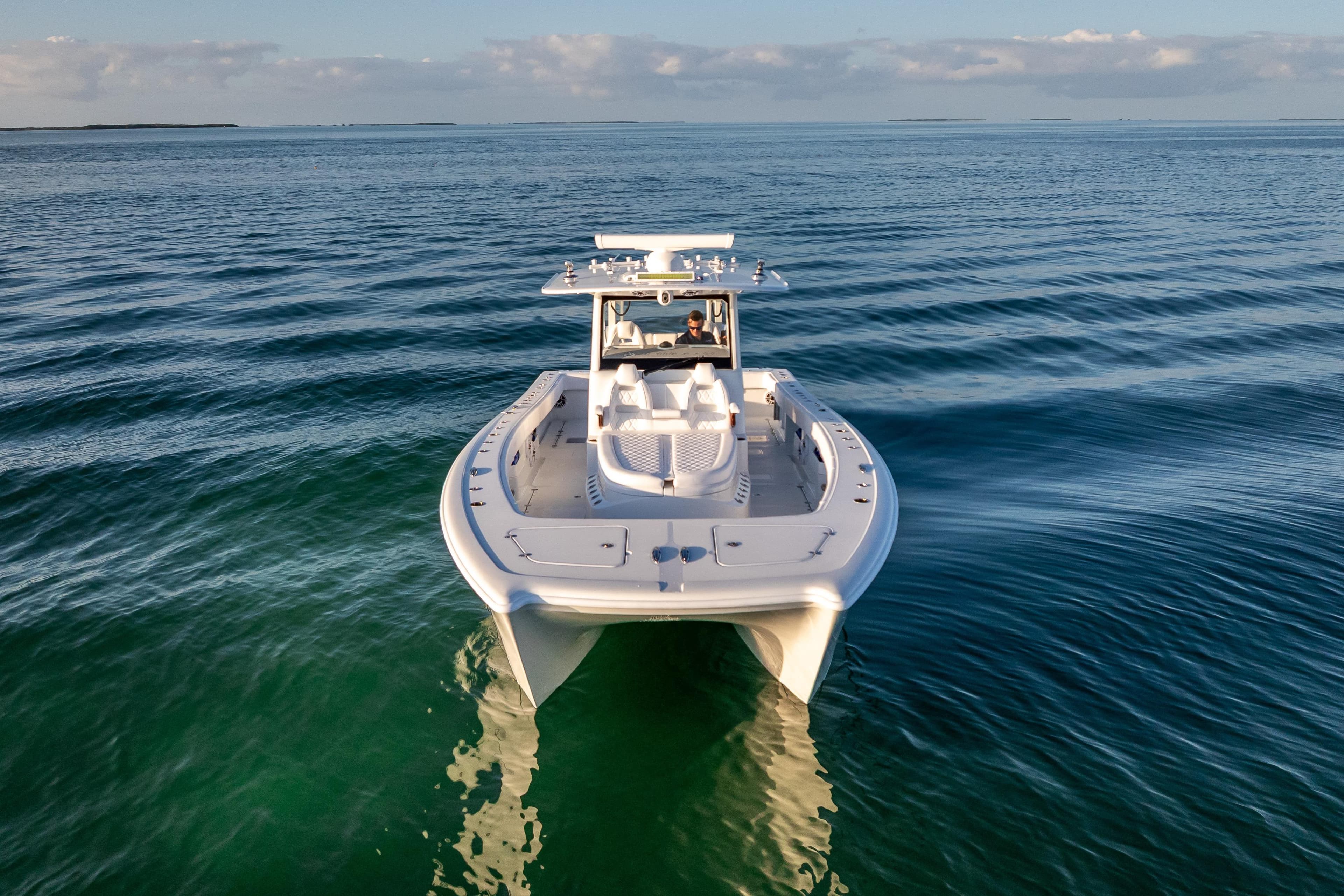 2026 Freeman 35 boat cruising on calm ocean waters under a clear sky.