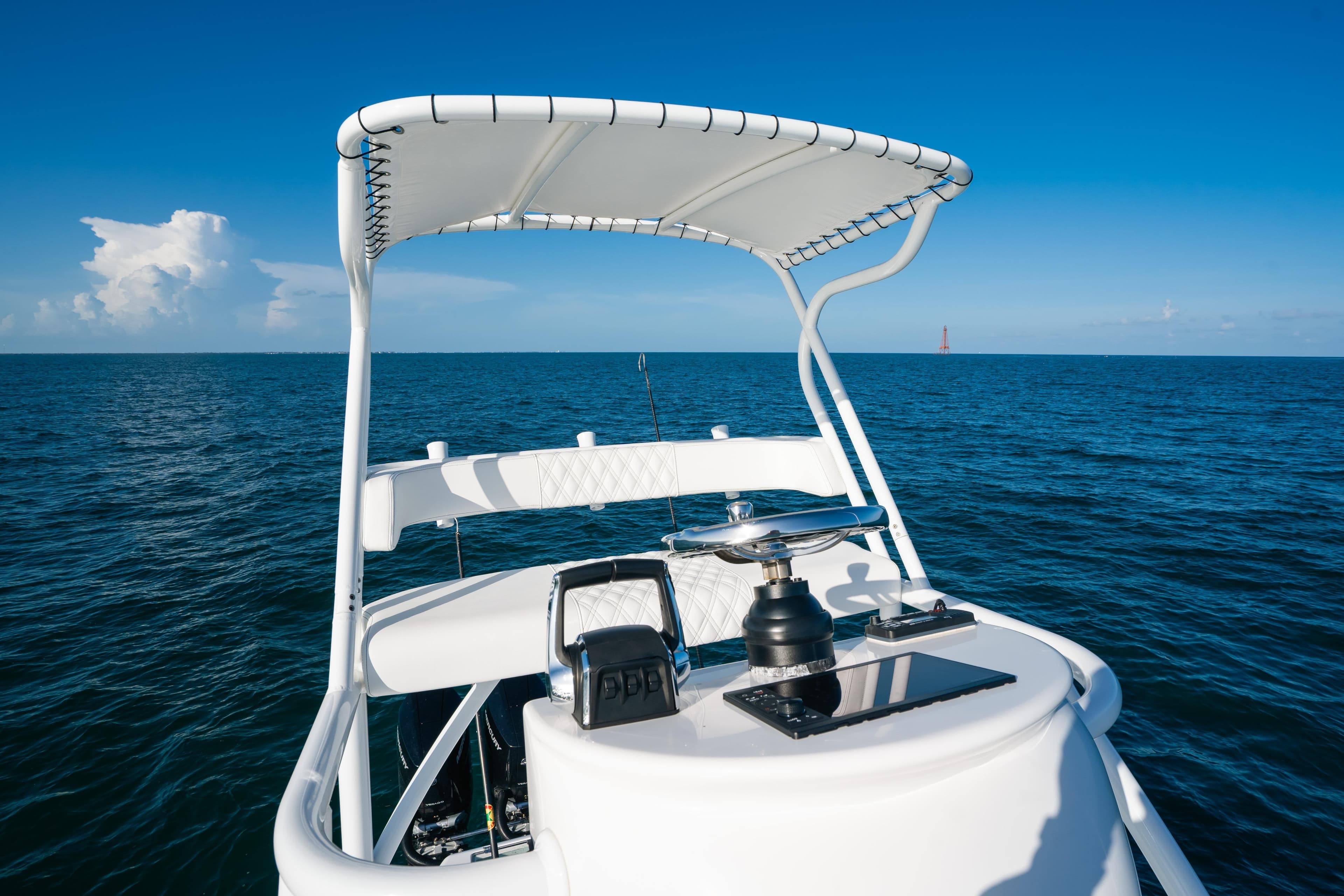 2023 Front Runner 39 Center Console boat on open ocean under clear blue sky.