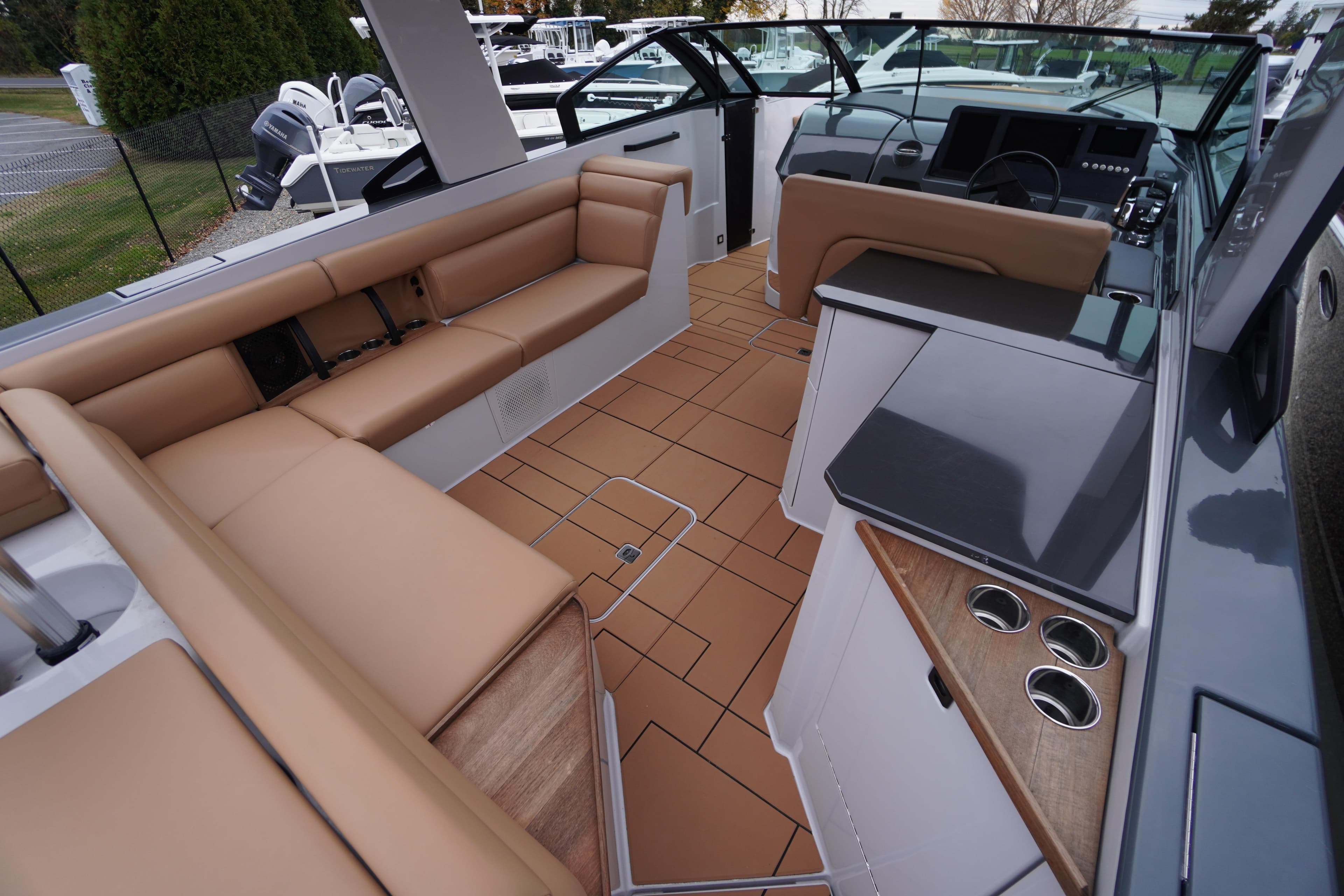2020 Aviara AV32 OB boat interior with tan seating and modern design.