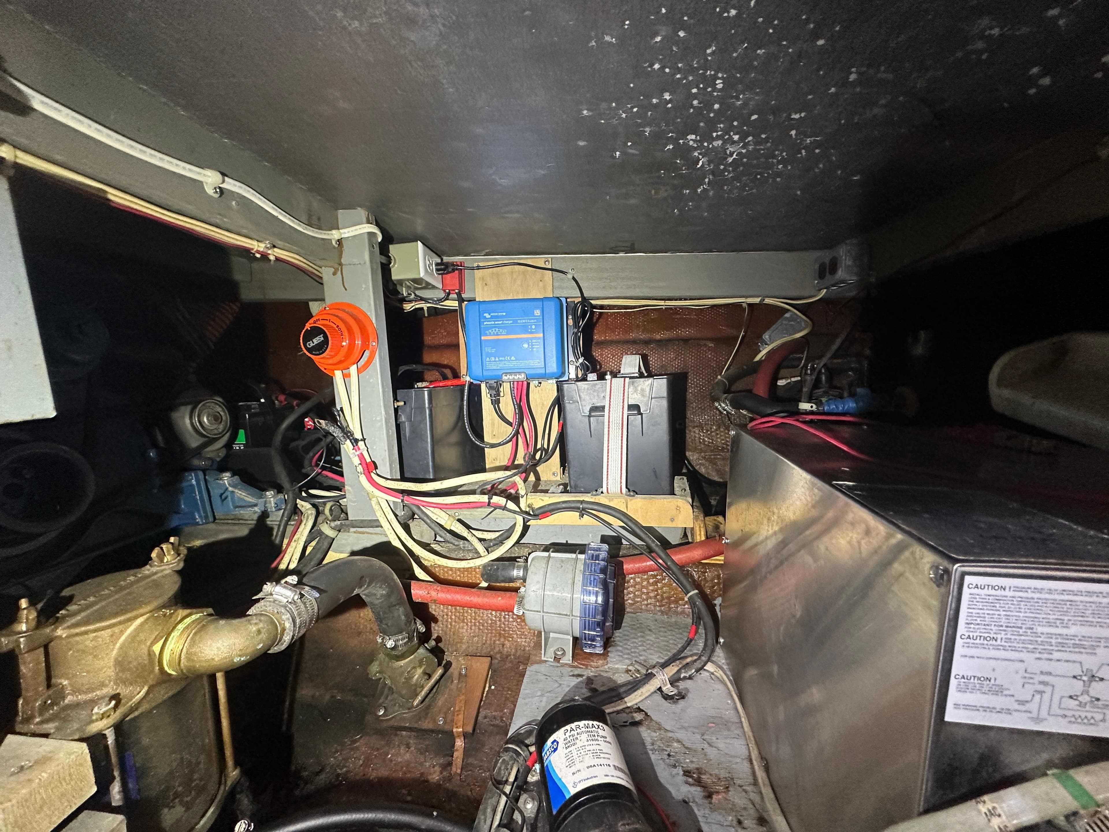 Engine room of 1979 Chris-Craft 350 Catalina with wiring and mechanical components.