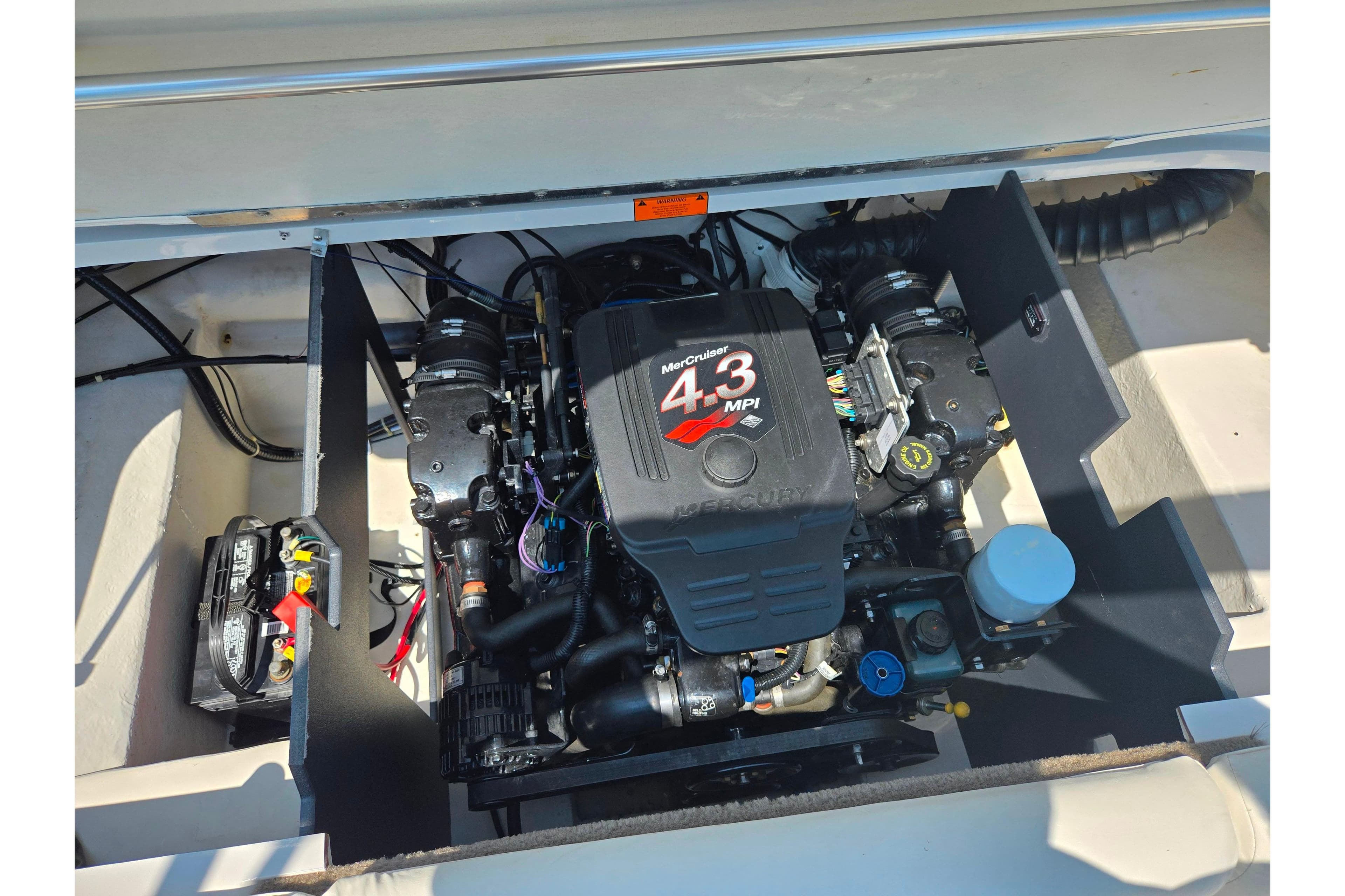 Engine compartment of a 2003 Tahoe Q5L boat with MerCruiser 4.3 MPI engine.